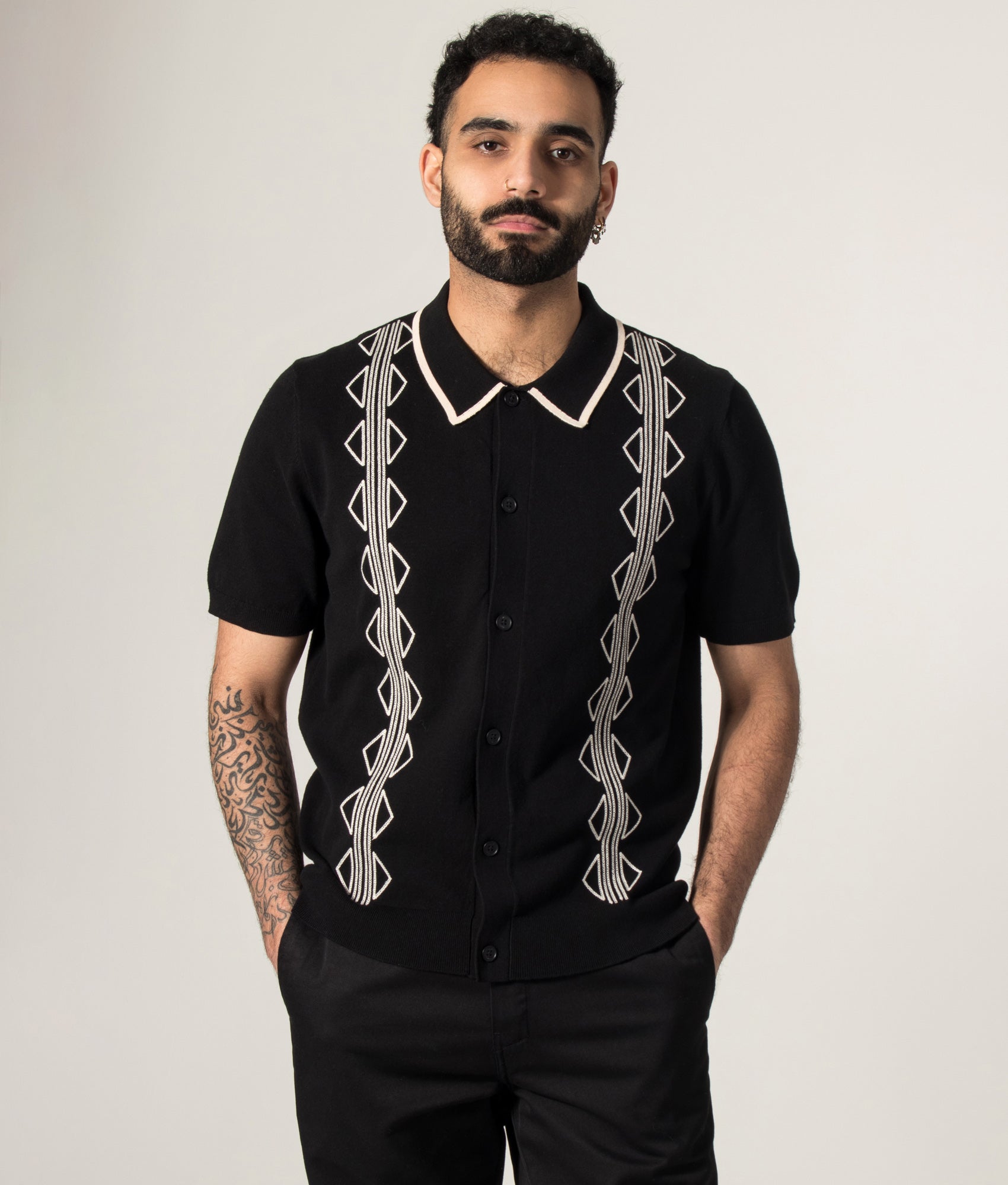 Tellaro Retro Embroidery Polo Shirt in Black/Ecru by Wax London. Shot by EQVVS. Model front shot.
