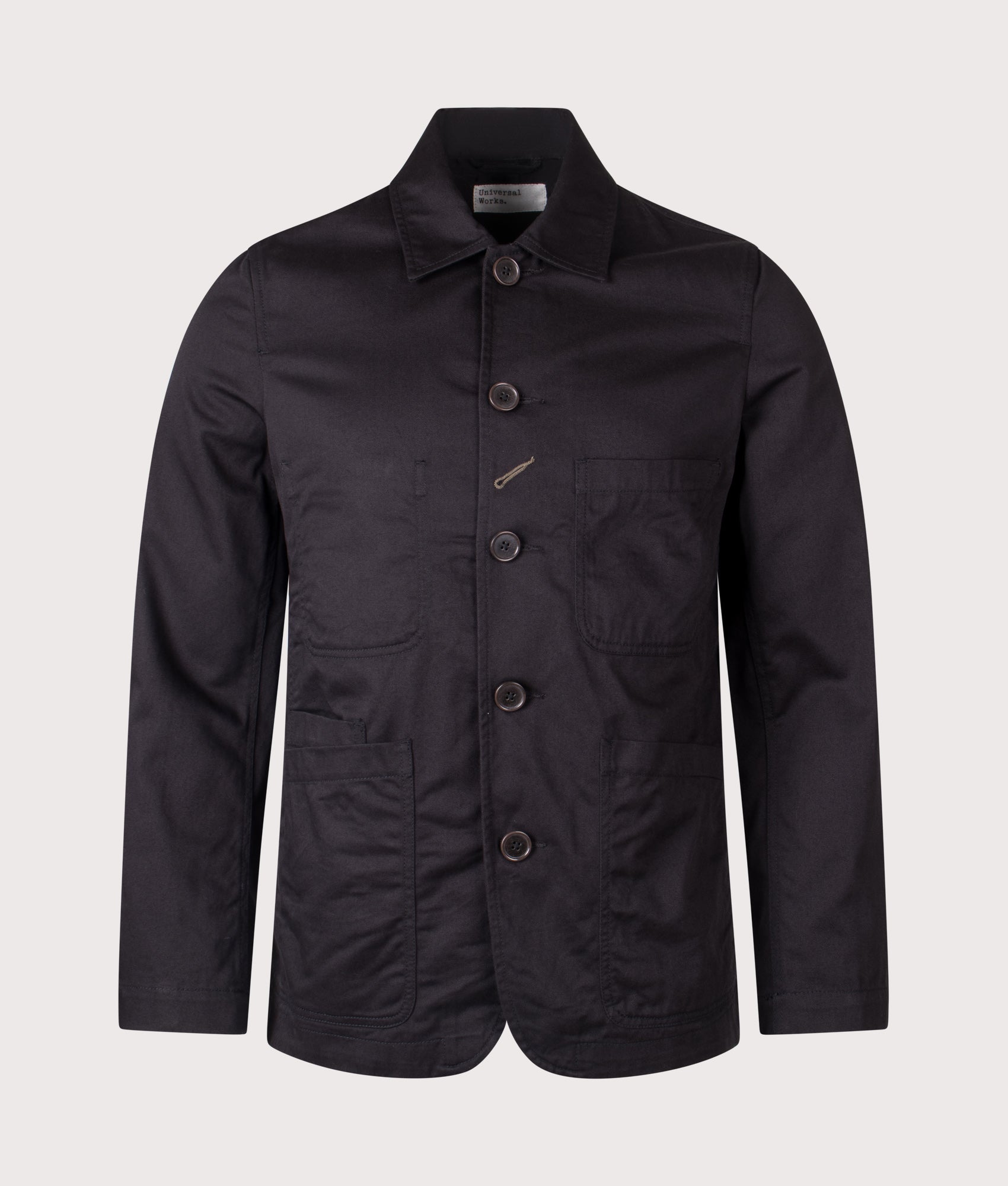 Universal Works Baker Jacket in Black at EQVVS Menswear. Front shot.