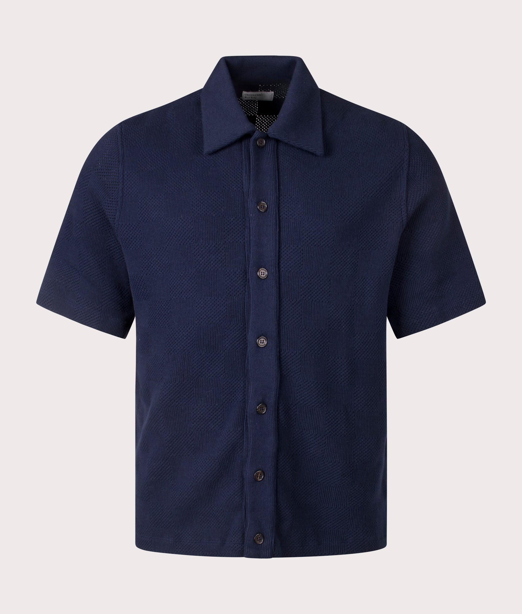 Univerasl Works Button Through Polo Shirt in Navy. Shot at EQVVS.  Front shot