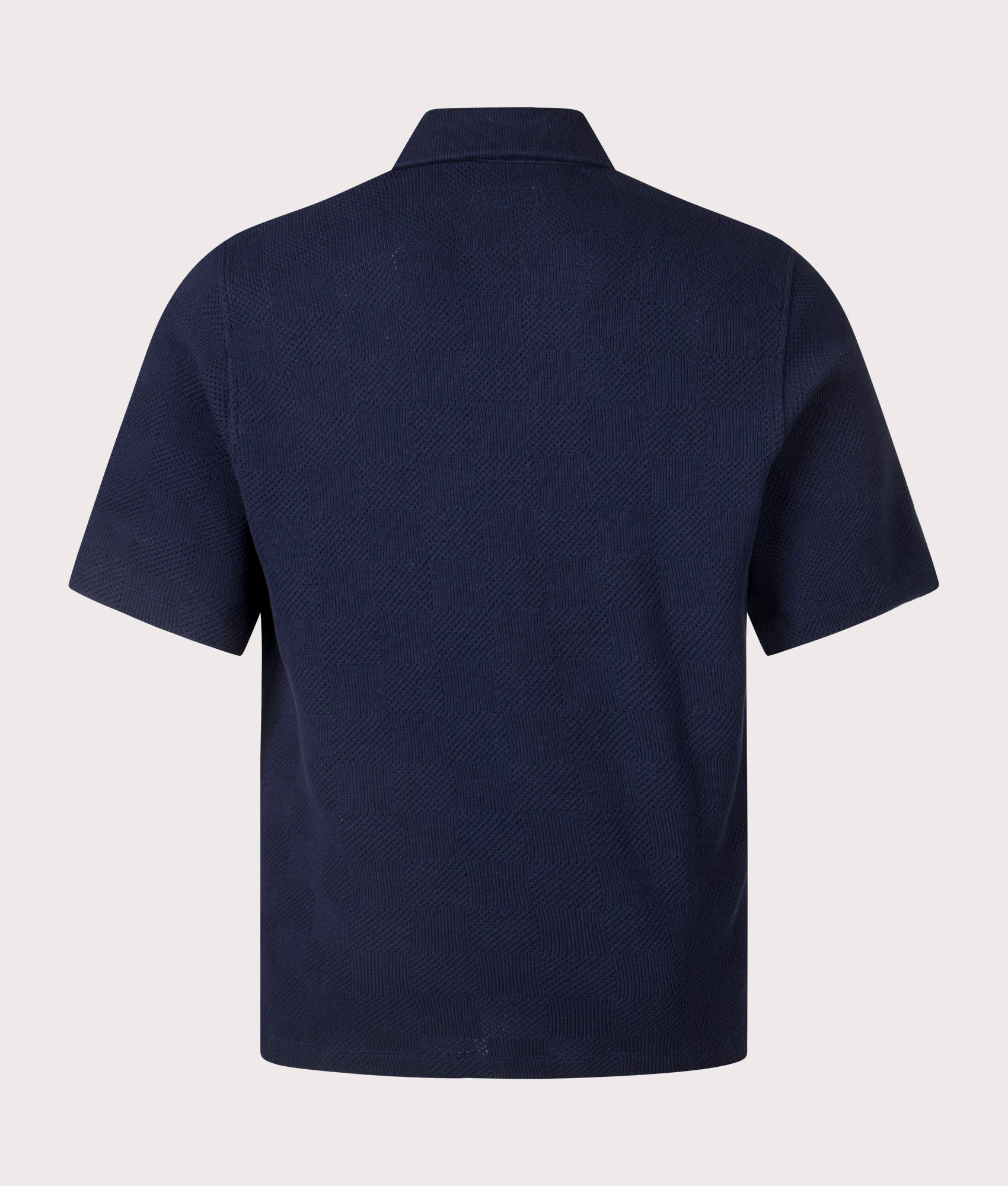 Univerasl Works Button Through Polo Shirt in Navy. Shot at EQVVS. Back Shot