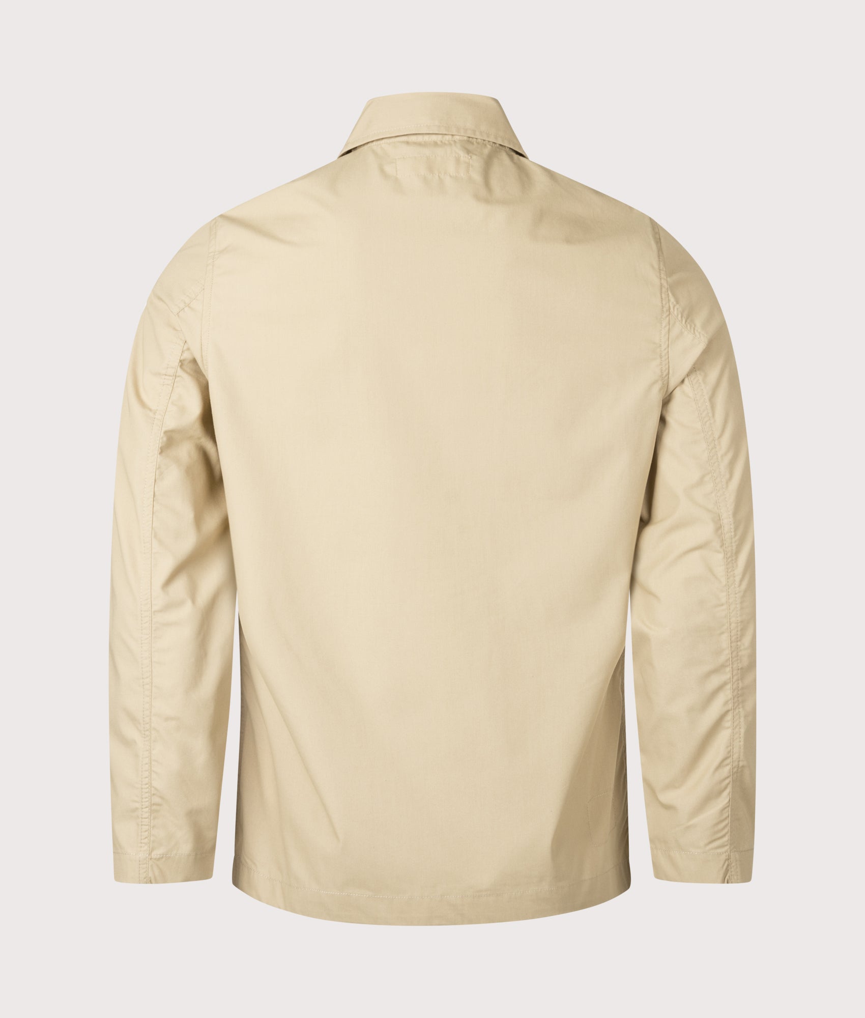 Universal Works Bakers Jacket in Sand. Shot at EQVVS.  Back shot. 