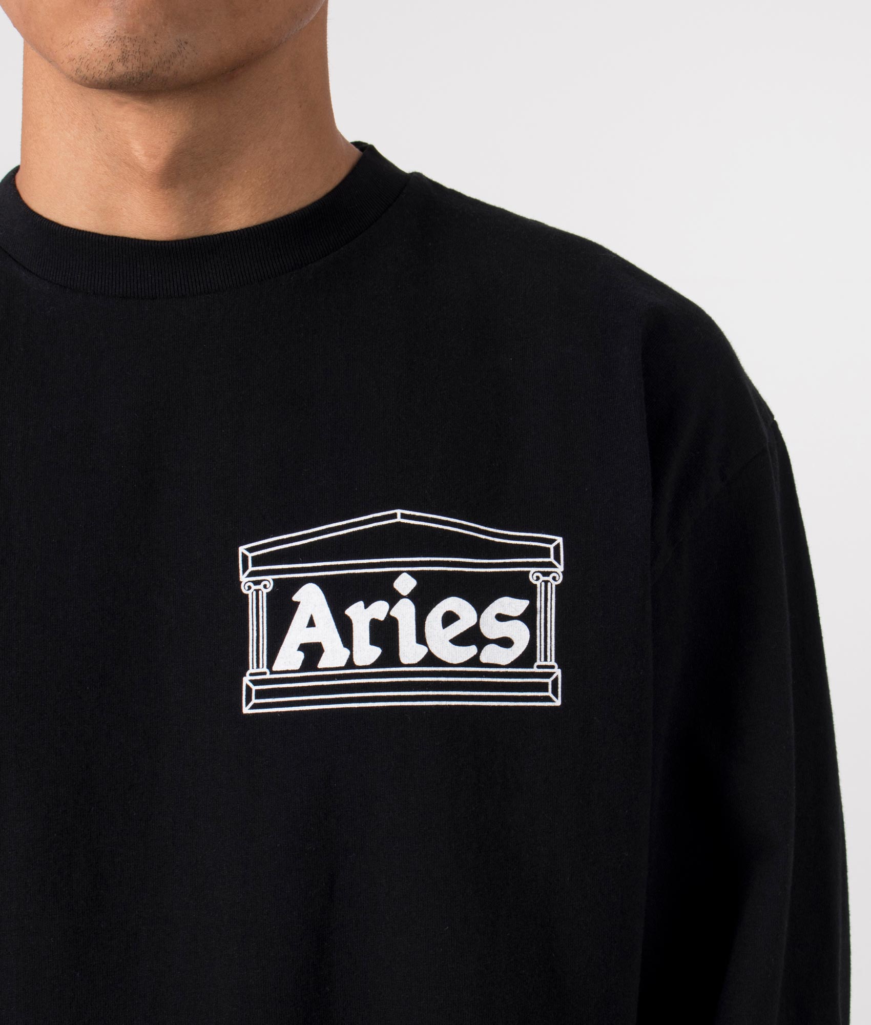 Temple Long Sleeve T-Shirt in Black by Aries. EQVVS Menswear Front Detail Model Shot. 