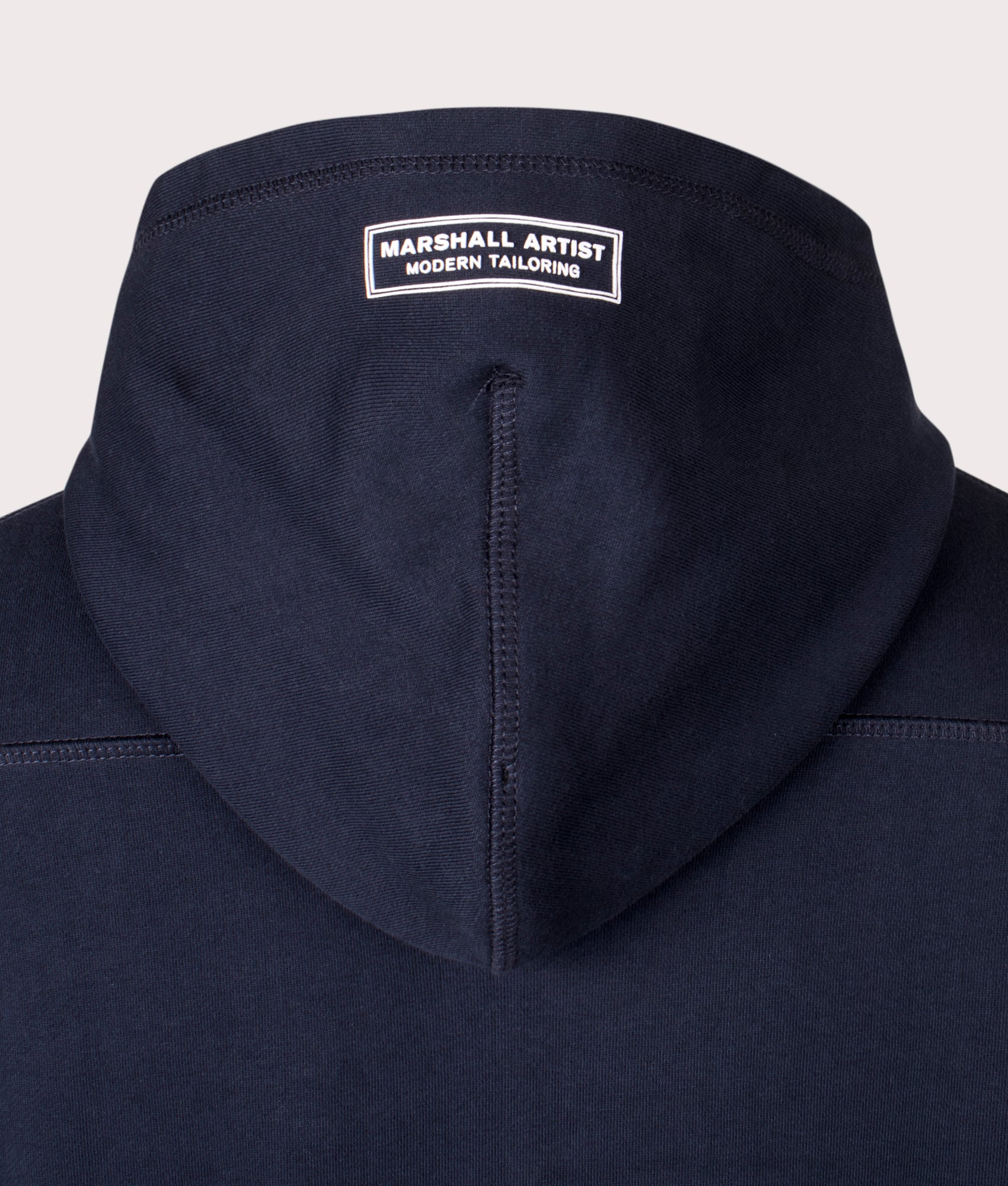 Siren Zip Through Hoodie in Navy by Marshall Artist. EQVVS Detail Shot.