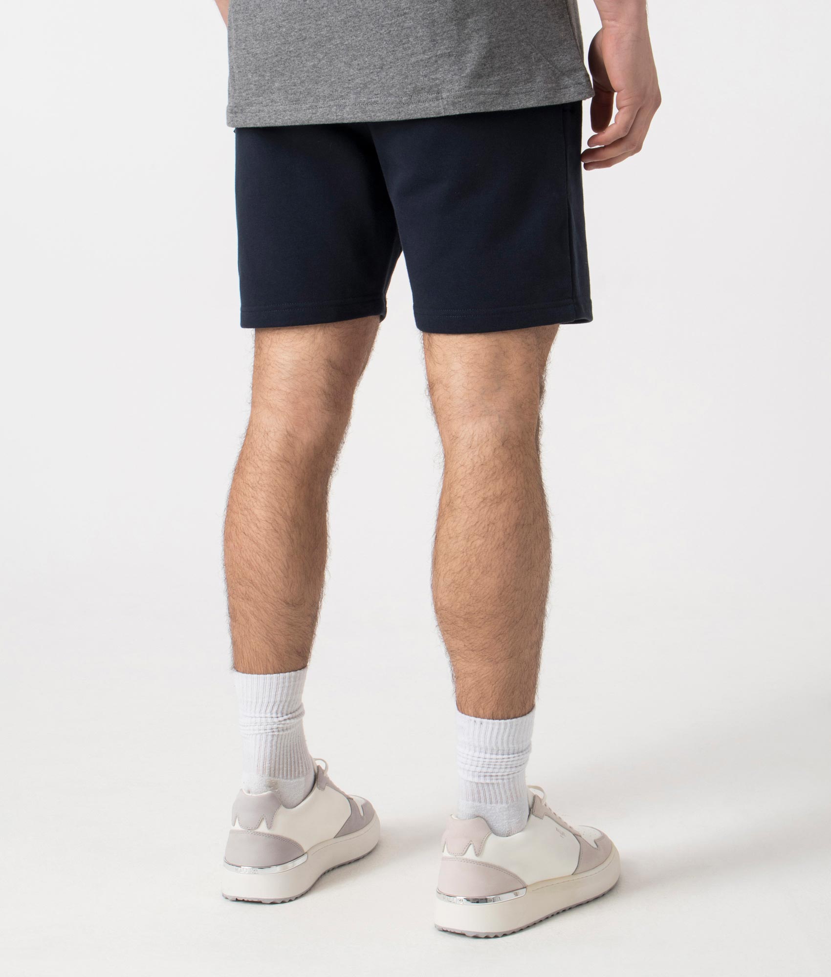 Siren Jersey Shorts in Navy by Marshall Artist. Back angle shot at EQVVS.