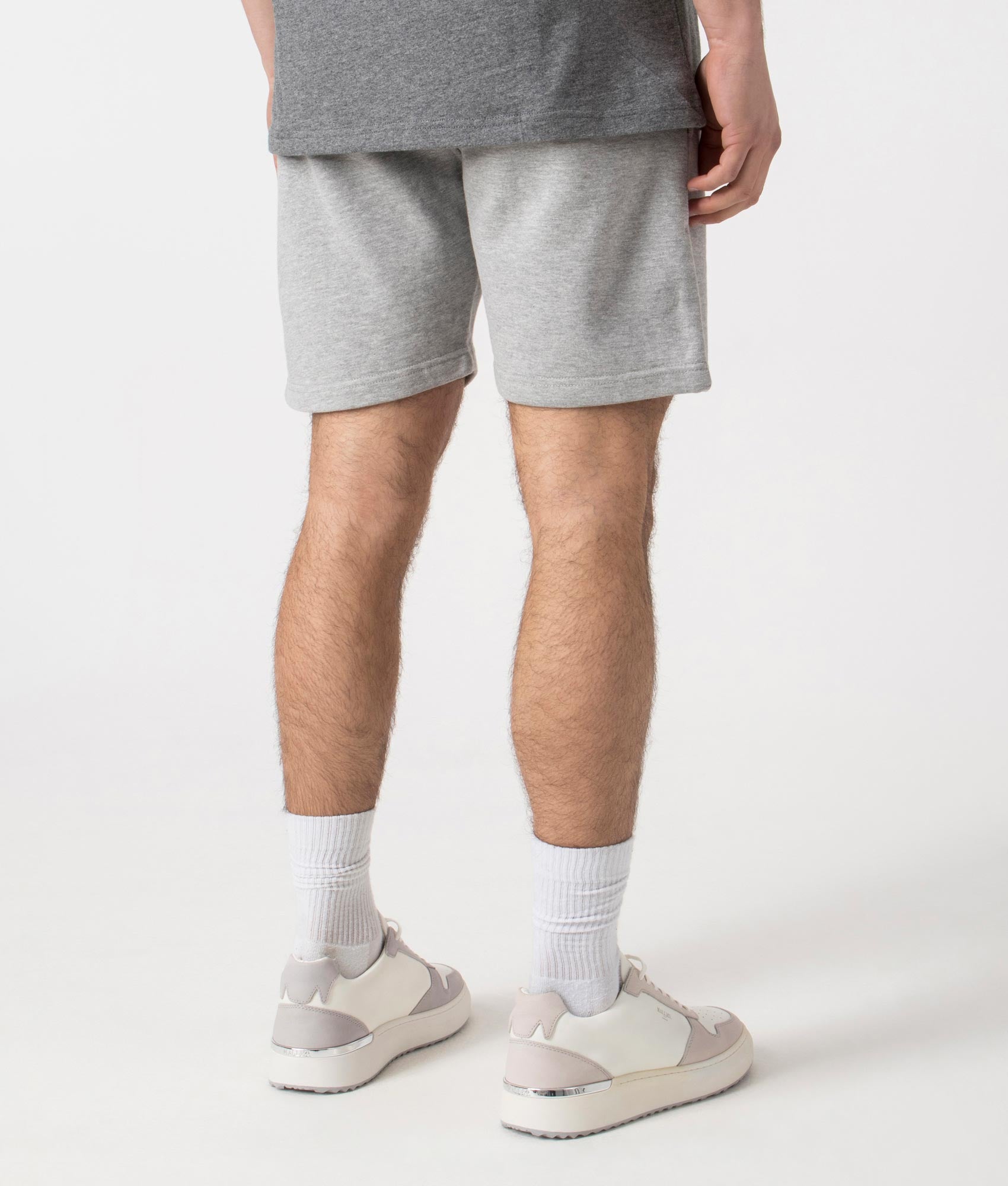 Siren Jersey Shorts in Grey Marl by Marshall Artist. Back angle shot at EQVVS.