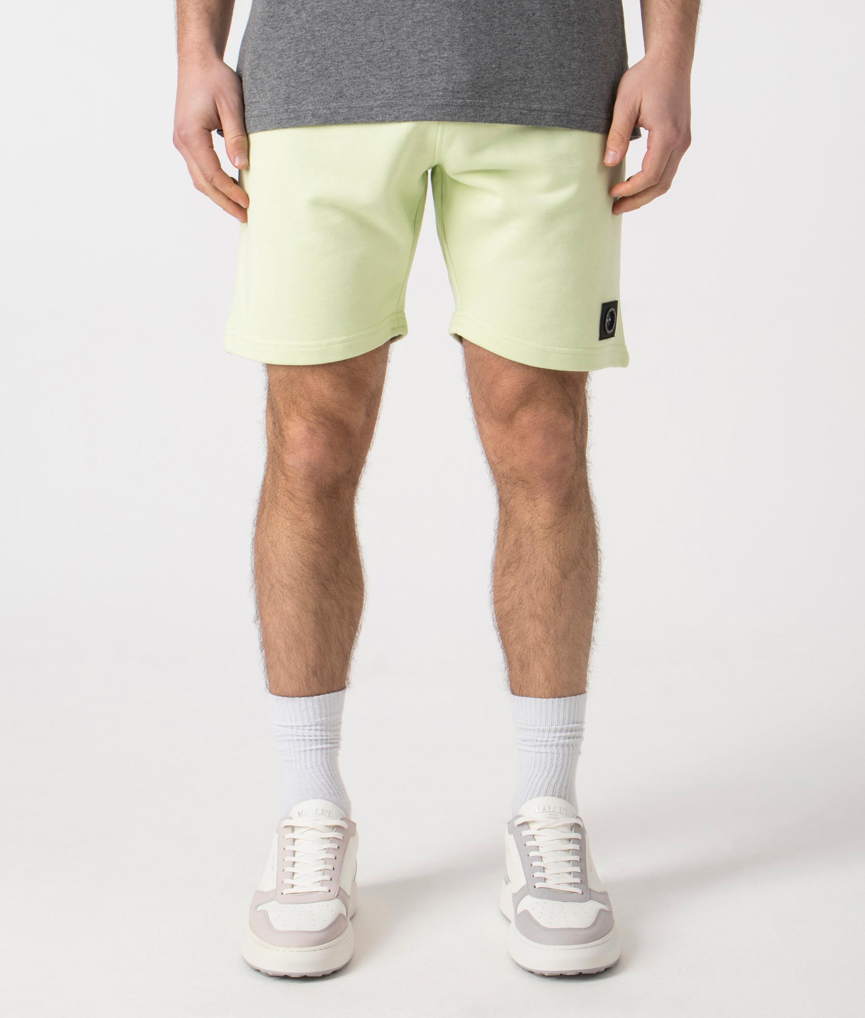 Siren Jersey Shorts in Lime by Marshall Artist. Front angle shot at EQVVS.