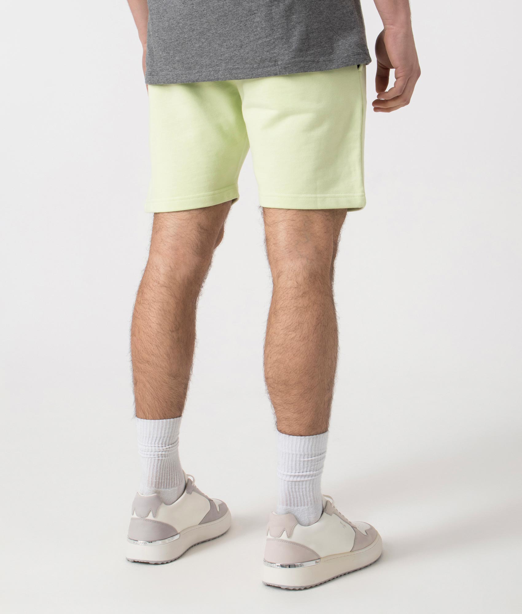 Siren Jersey Shorts in Lime by Marshall Artist. Back angle shot at EQVVS.