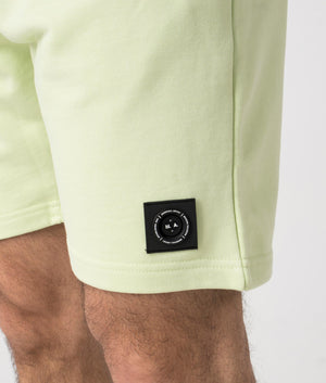 Siren Jersey Shorts in Lime by Marshall Artist. Detail shot at EQVVS.