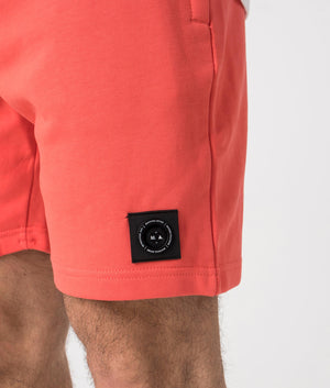 Siren Jersey Shorts in Coral by Marshall Artist. Detail shot at EQVVS.