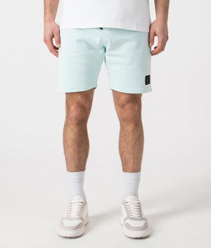 Siren Jersey Shorts in Sky Blue by Marshall Artist. Front angle shot at EQVVS.