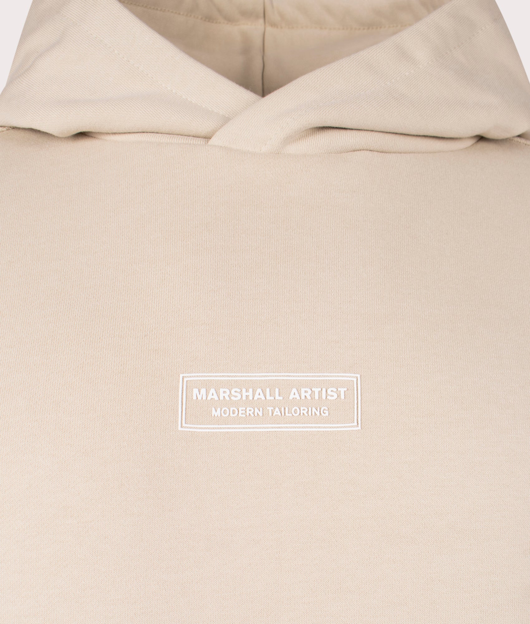Marshall Artist Siren Overhead Hoodie in 010 sandstone 100% cotton chest detail shot at EQVVS