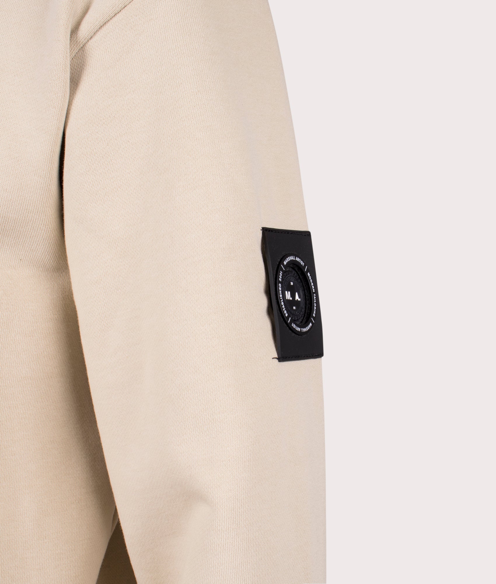 Marshall Artist Siren Overhead Hoodie in 010 sandstone 100% cotton arm detail shot at EQVVS