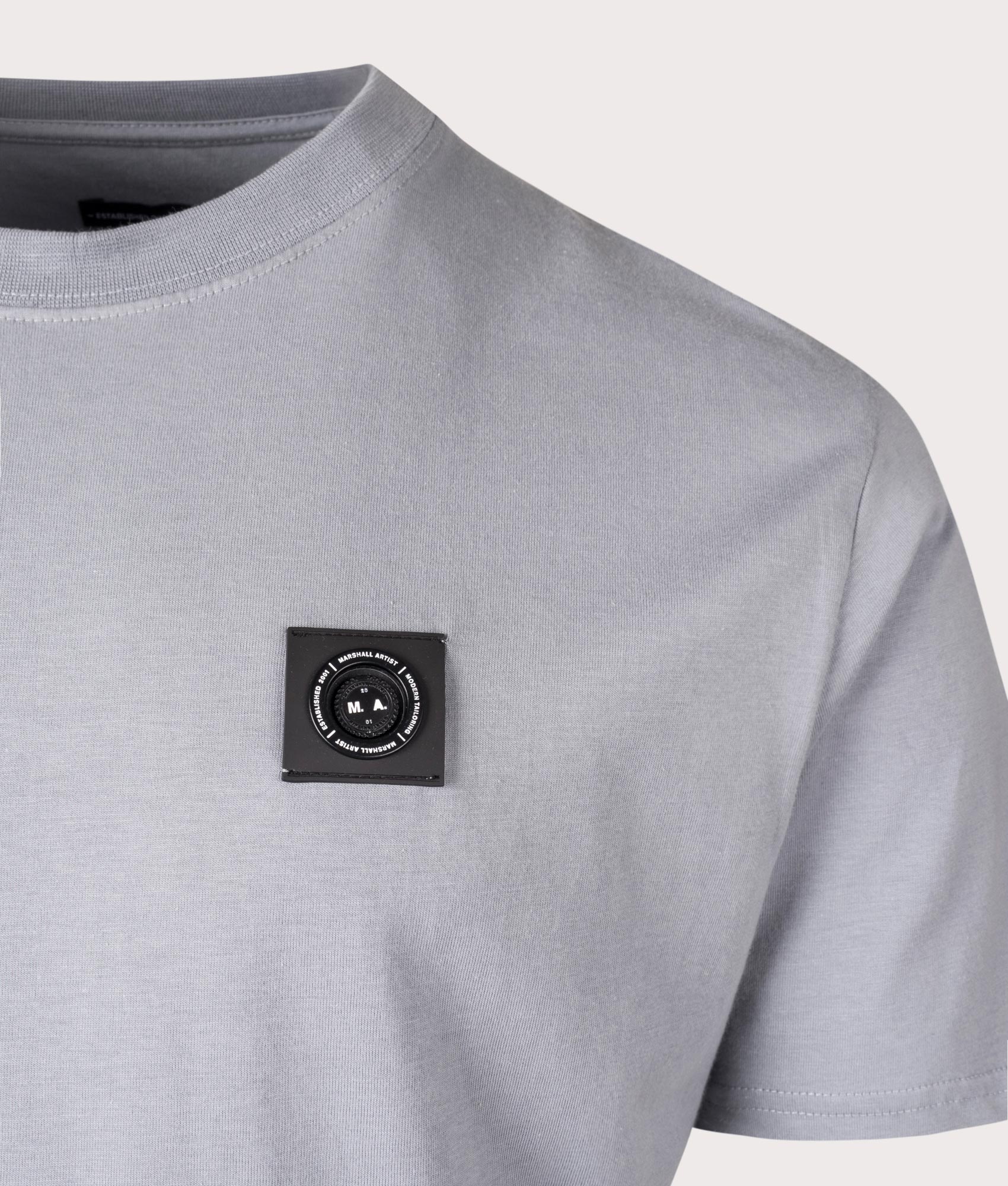 Siren T-Shirt in Nardo Grey by Marshall Artist. Shot at EQVVS. Detail shot. 