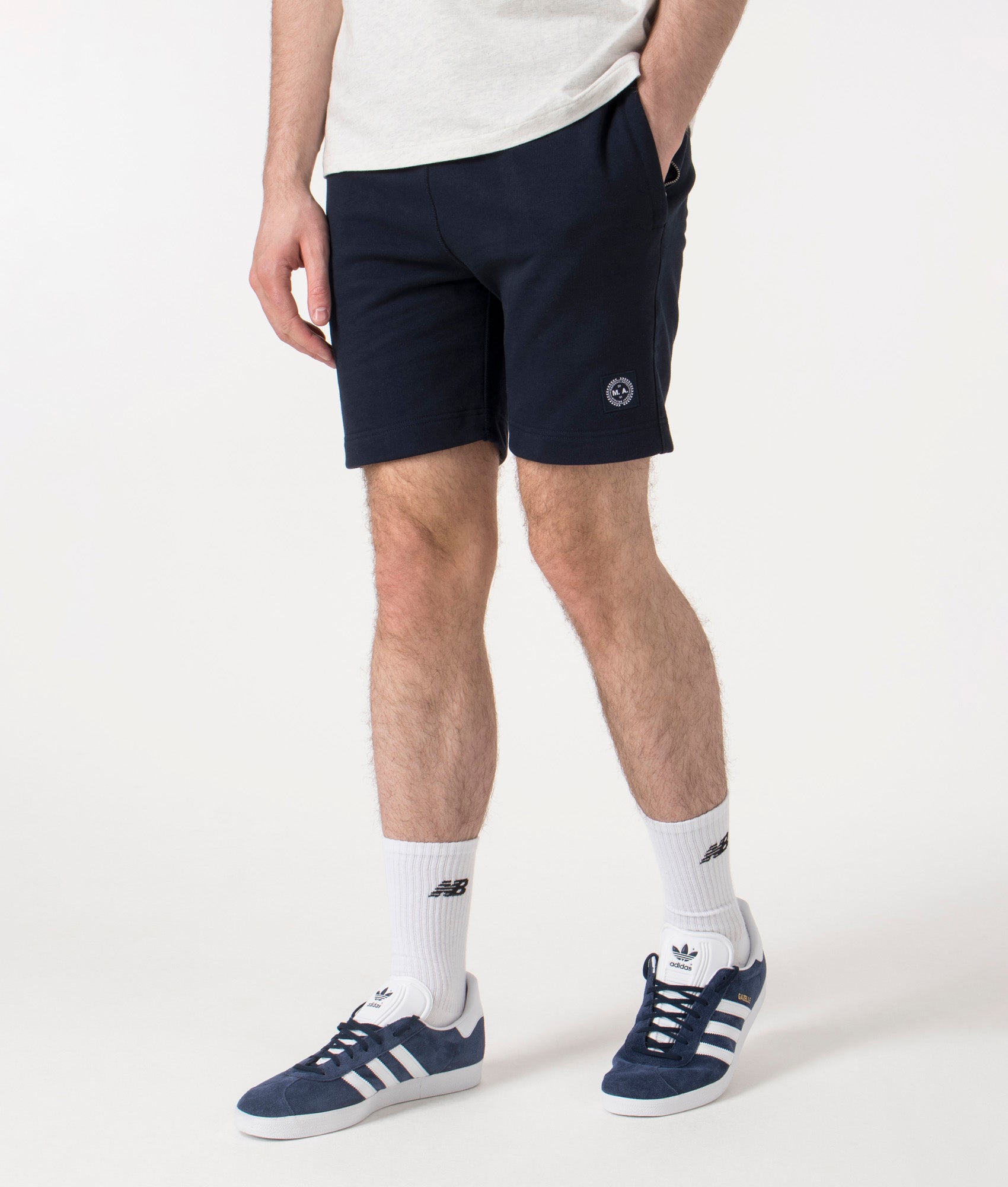 Marshall Artist Foundation Shorts in Navy at EQVVS. Angle Shot.