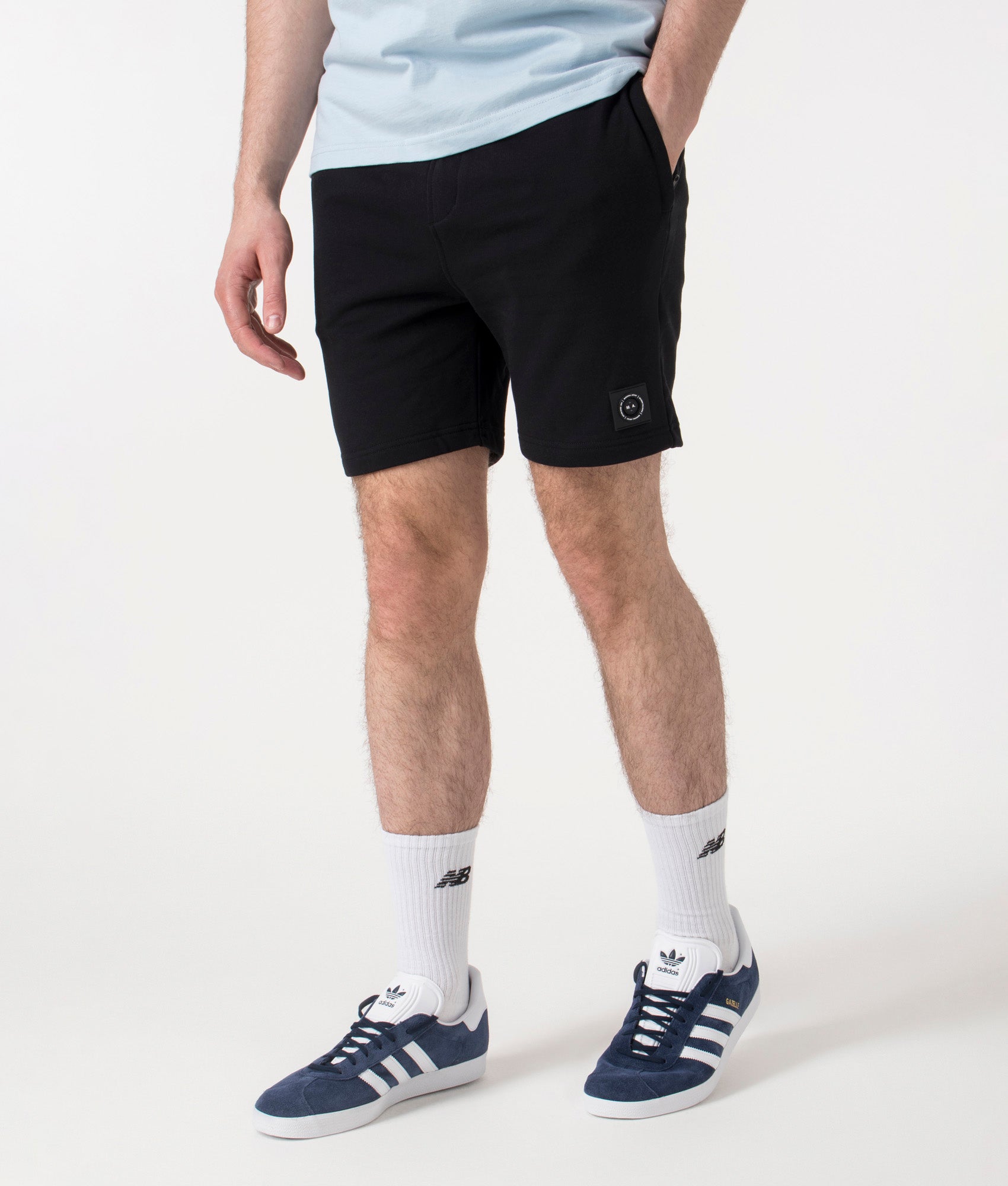 Marshall Artist Siren Loopback Shorts in Black at EQVVS. Front Angle Shot.