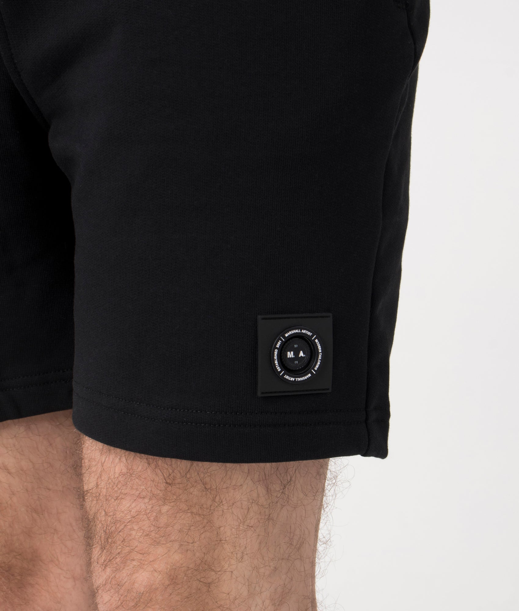 Marshall Artist Siren Loopback Shorts in Black at EQVVS. Detail Shot.