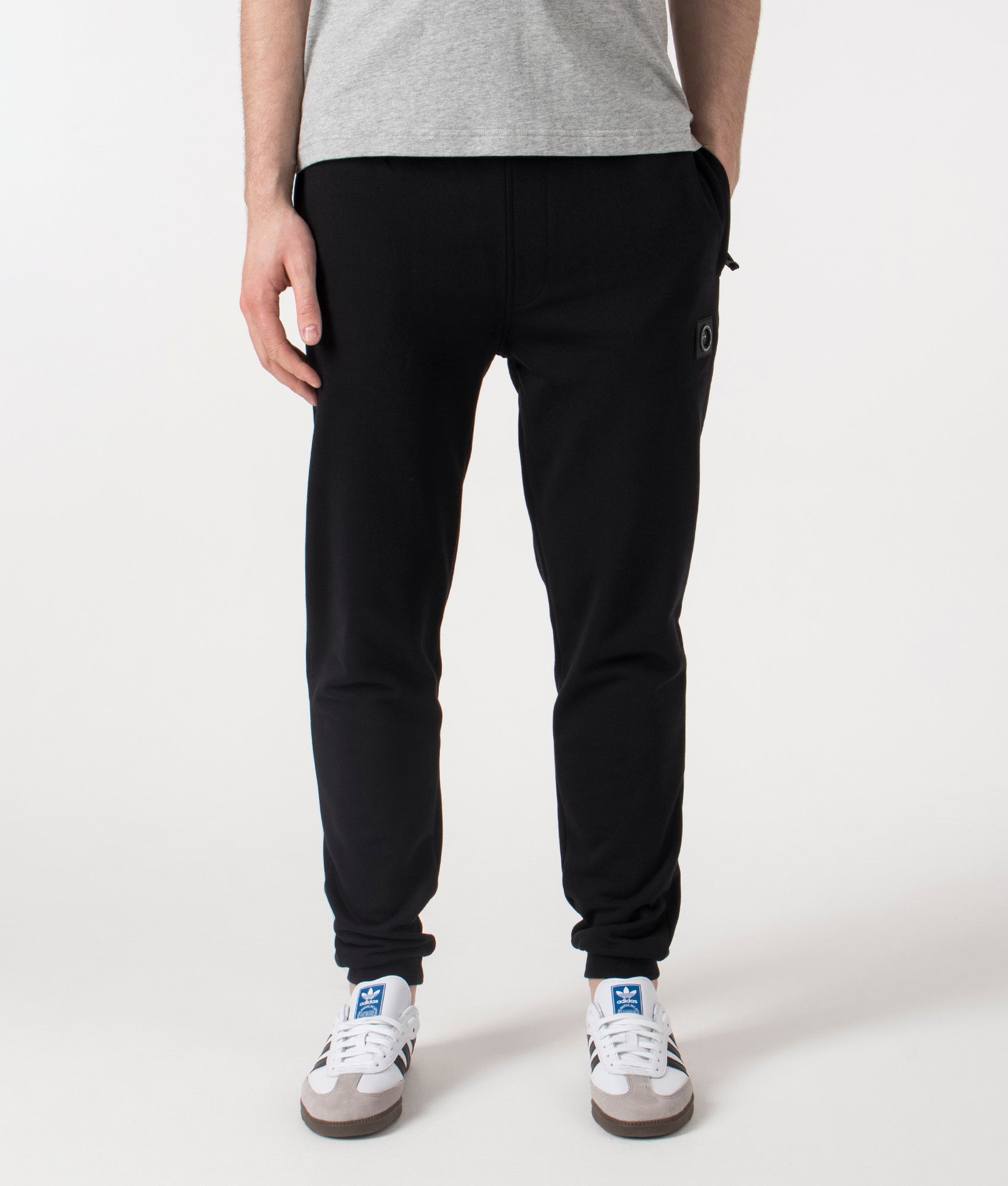 Marshall Artist Relaxed Fit Siren Joggers in Black at EQVVS. Front shot.