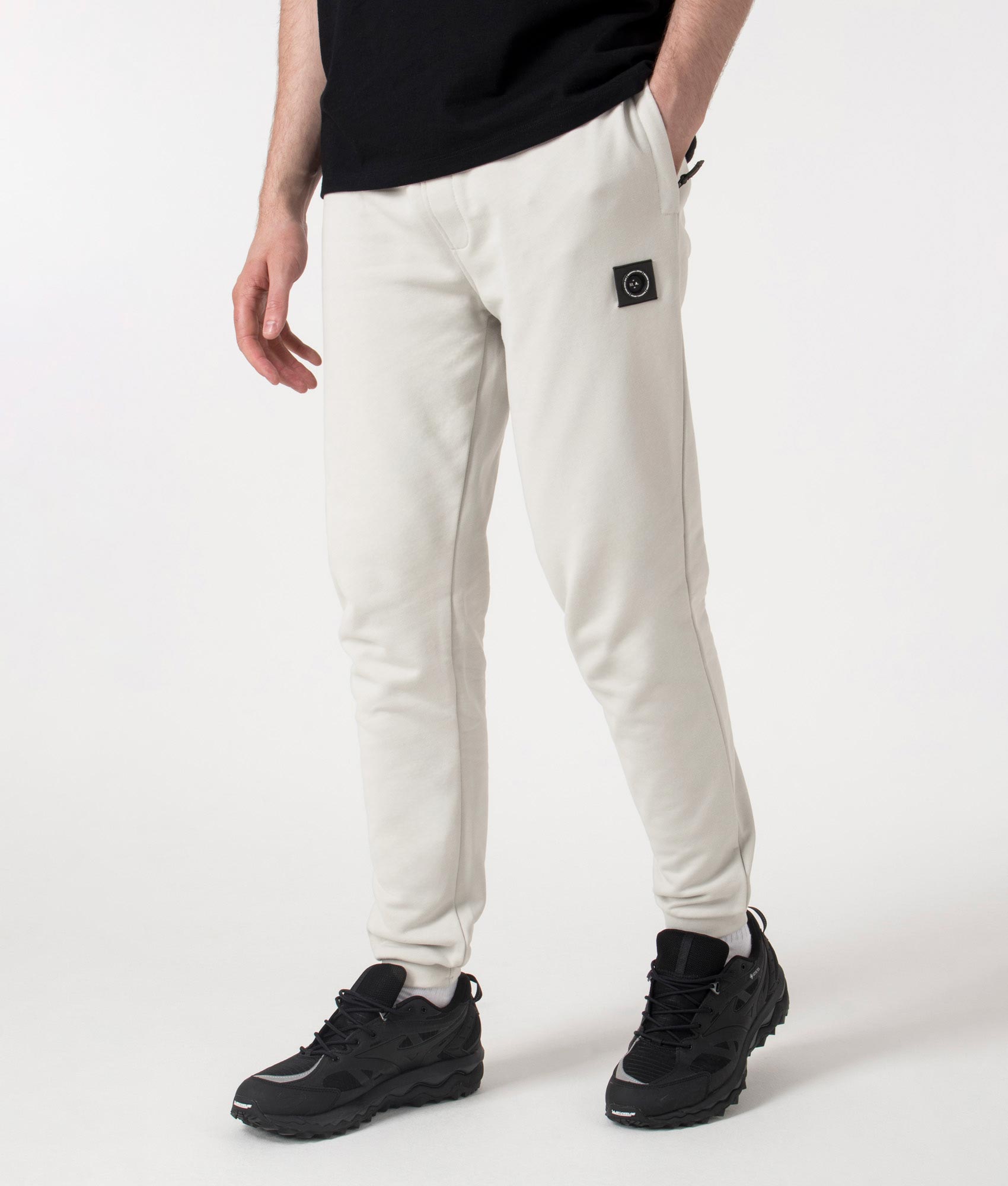 Marshall Artist Relaxed Fit Siren Joggers in Dove Grey at EQVVS. Angle shot.