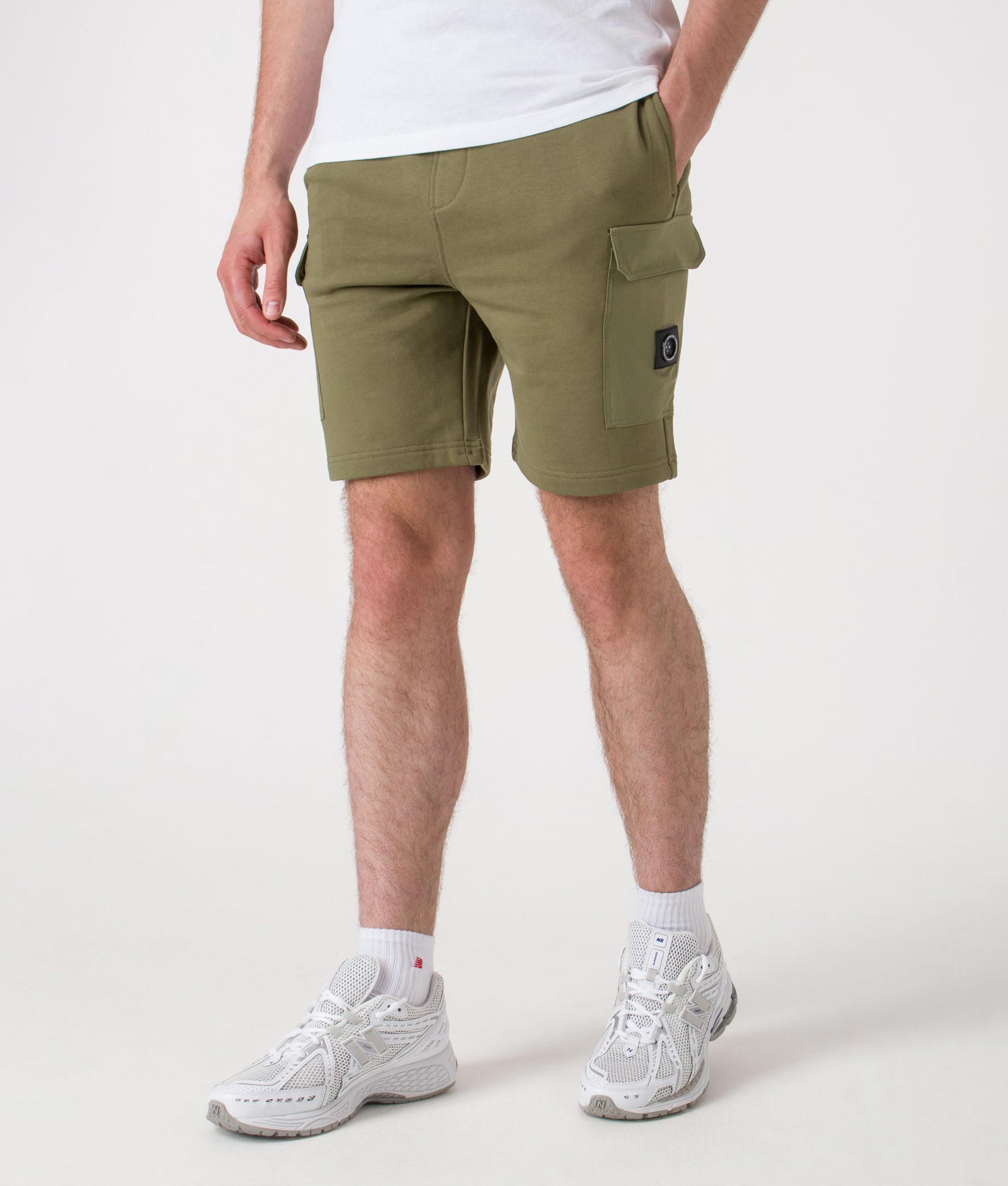 Aksu Jersey Cargo Shorts. Shot by EQVVS. Front angled model shot.