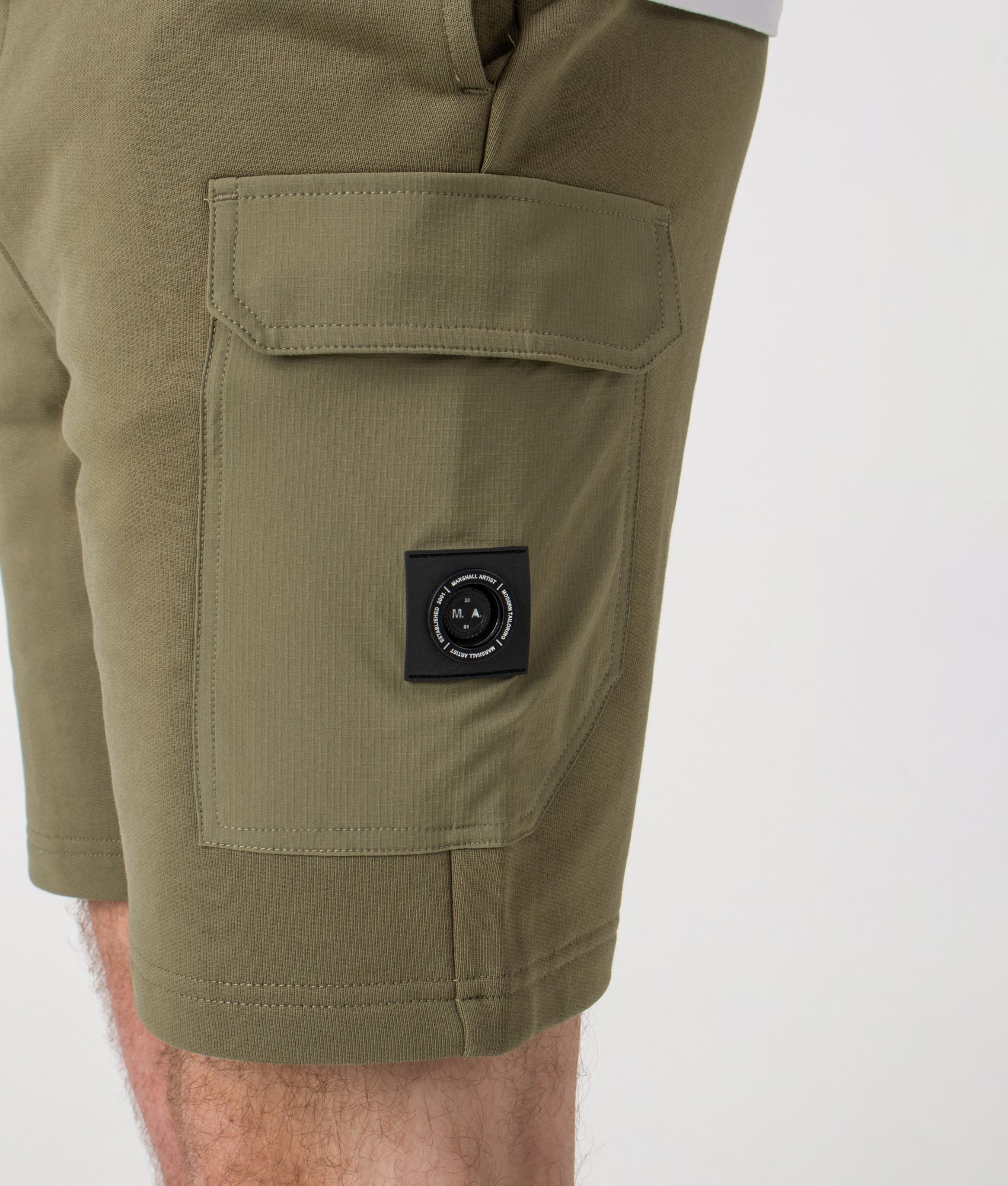 Aksu Jersey Cargo Shorts. Shot by EQVVS. Model detail shot.