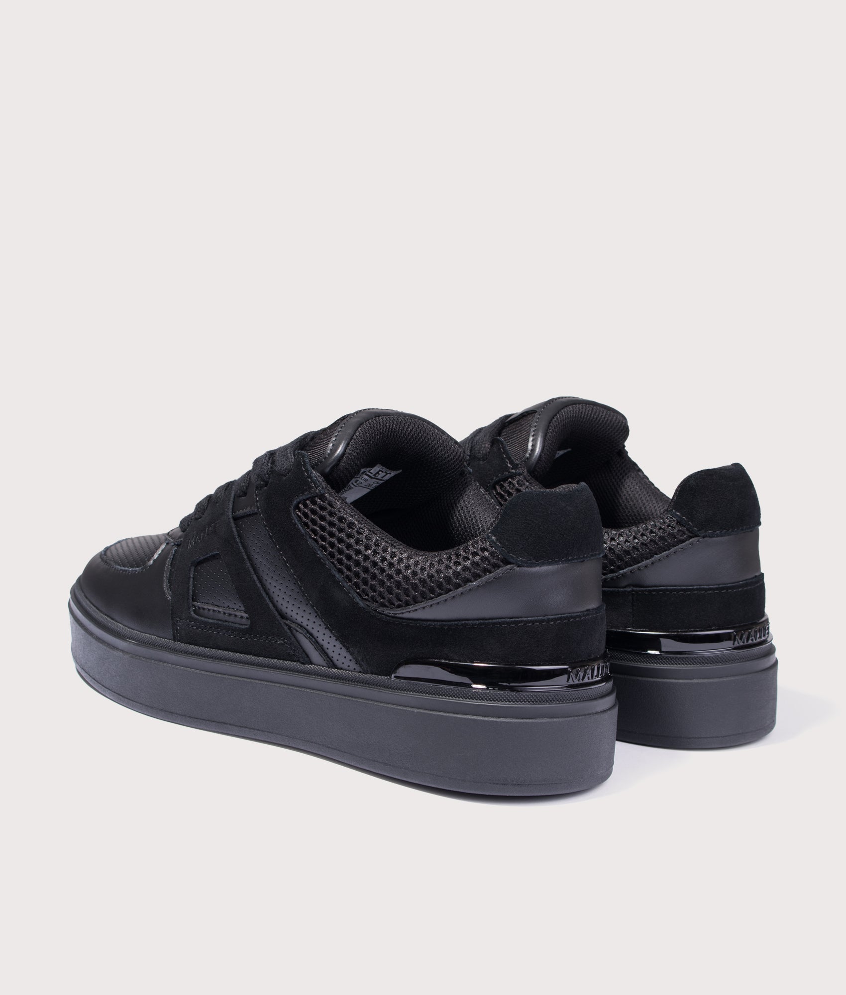 Mallet Fenchurch Trainers in Triple Black at EQVVS Menswear. Angled back shot.