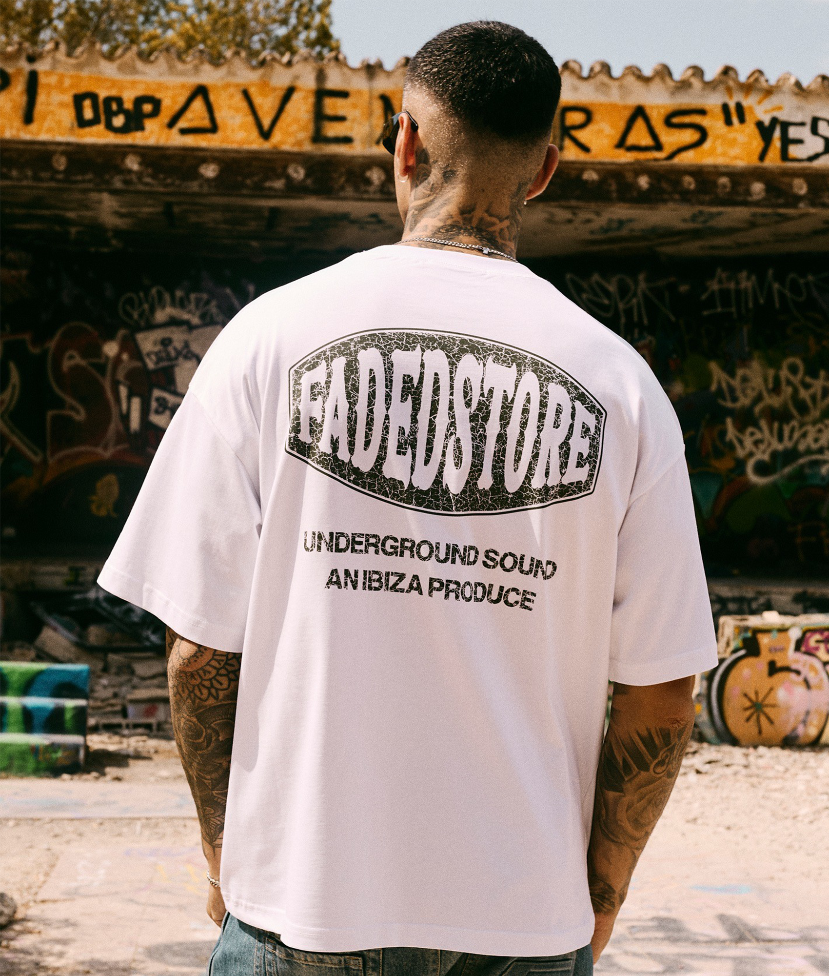 FADED Oval T-Shirt in white at EQVVS Menswear. Campaign shot.