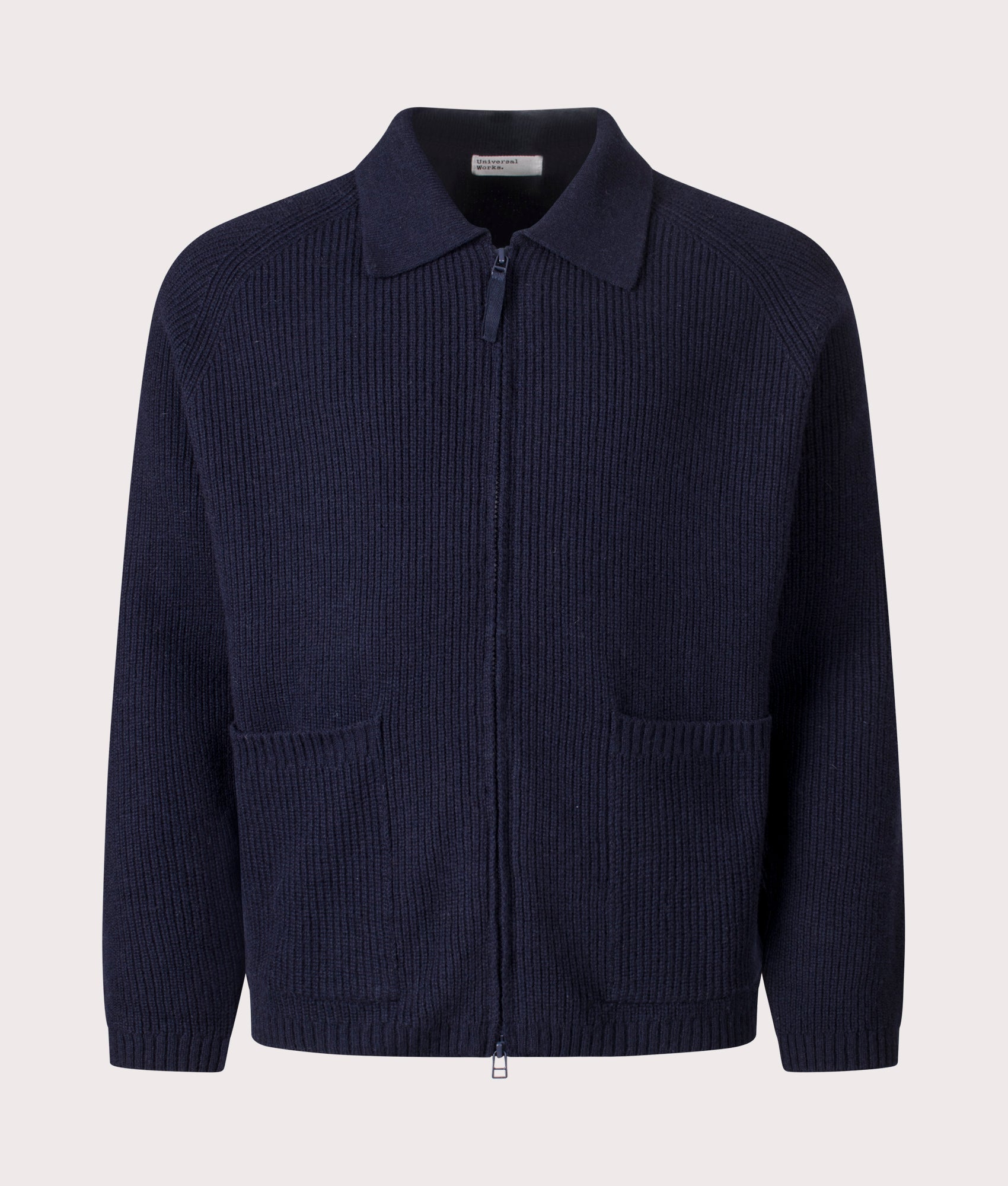 Universal Works Relaxed Fit Wool Zip Cardigan in Navy at EQVVS Menswear. Front shot.