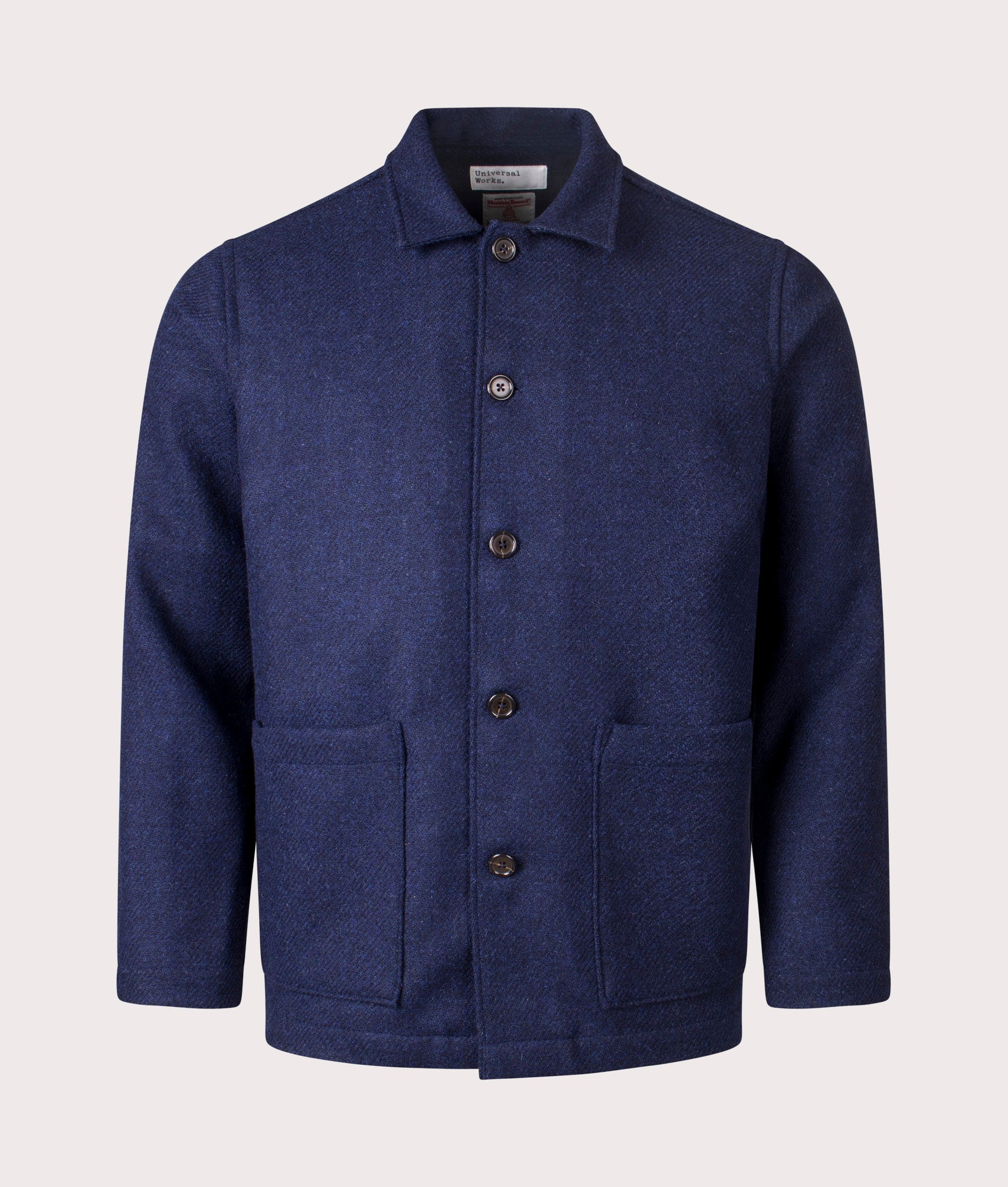 Universal Works Harris Tweed Easy Jacket in Indigo at EQVVS Menswear. Front shot. 