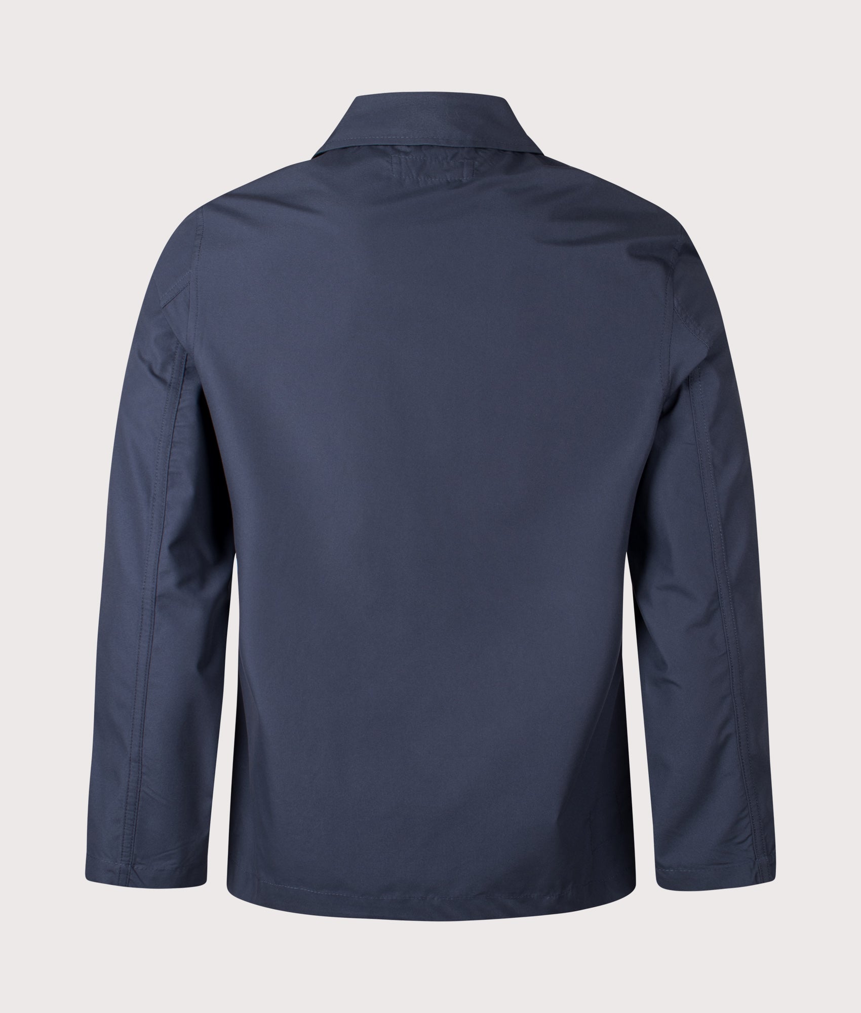 Universal Works Recycled Polytech Bakers Jacket in Navy at EQVVS Menswear. Back shot.
