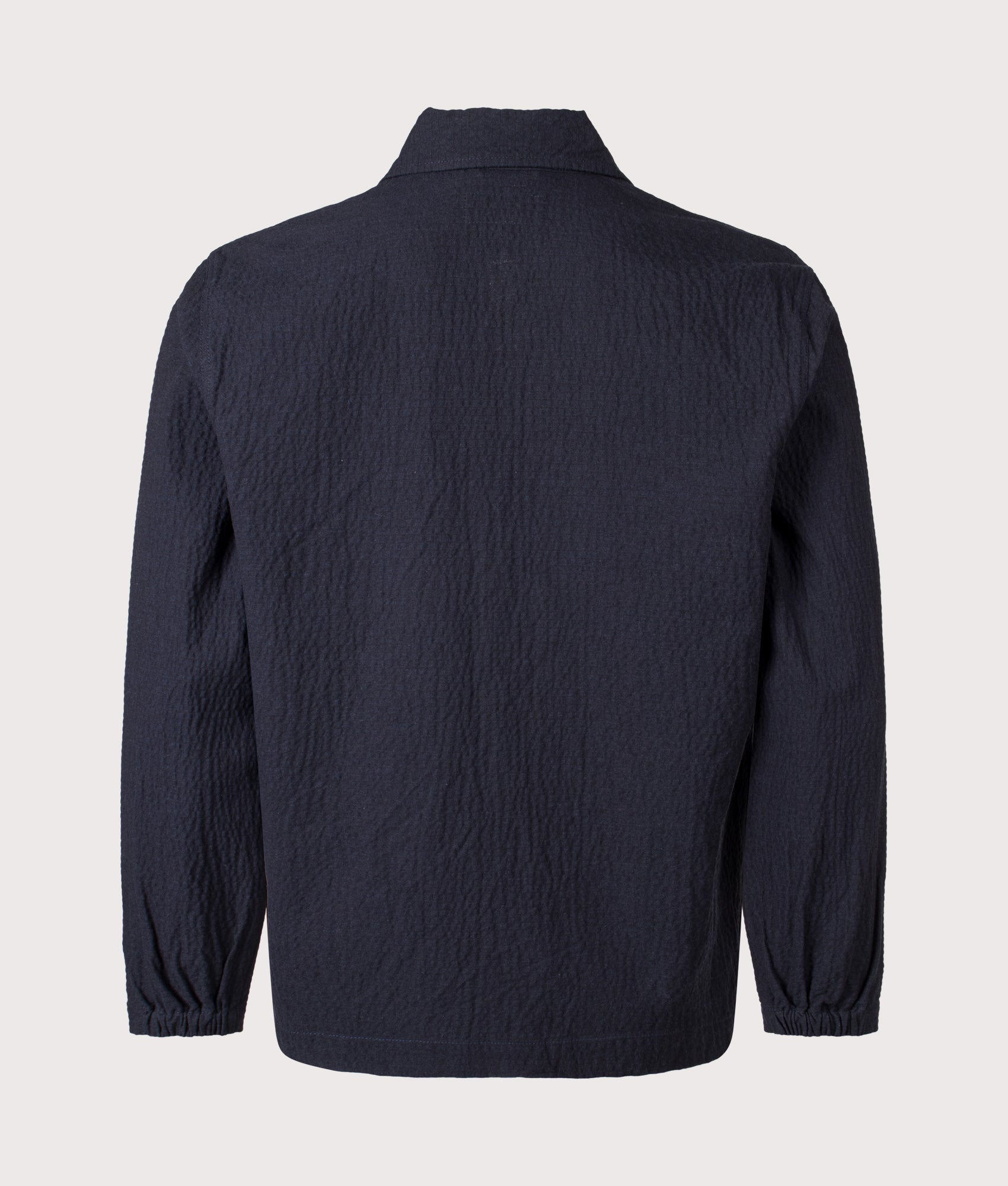 Universal Works Relaxed fit Ospina Cotton Labour Jacket in Navy at EQVVS Menswear. Back shot.