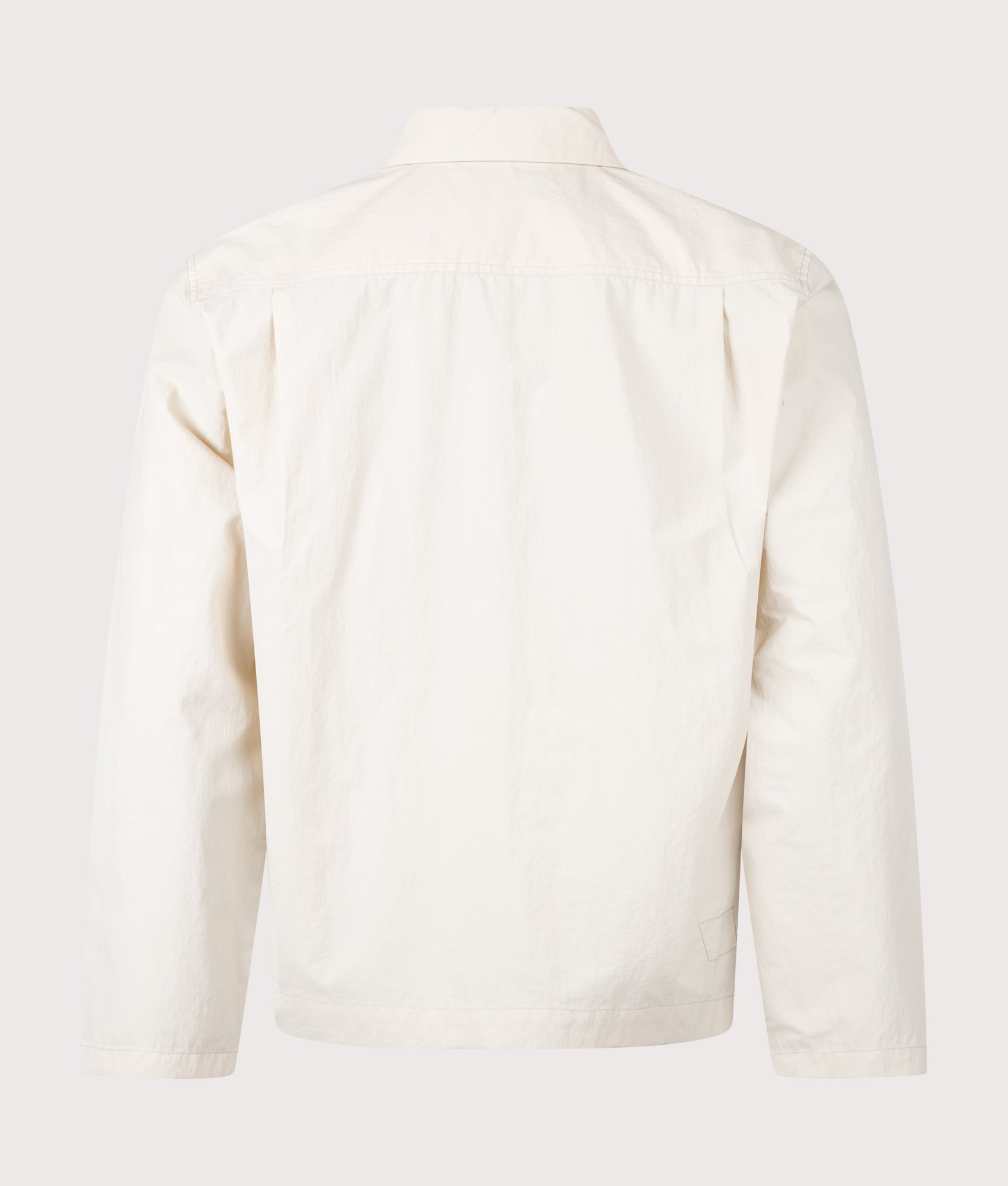 Universal Works Seo Recycled Nylon Zip Too Overshirt in Stone at EQVVS Menswear. Back shot.
