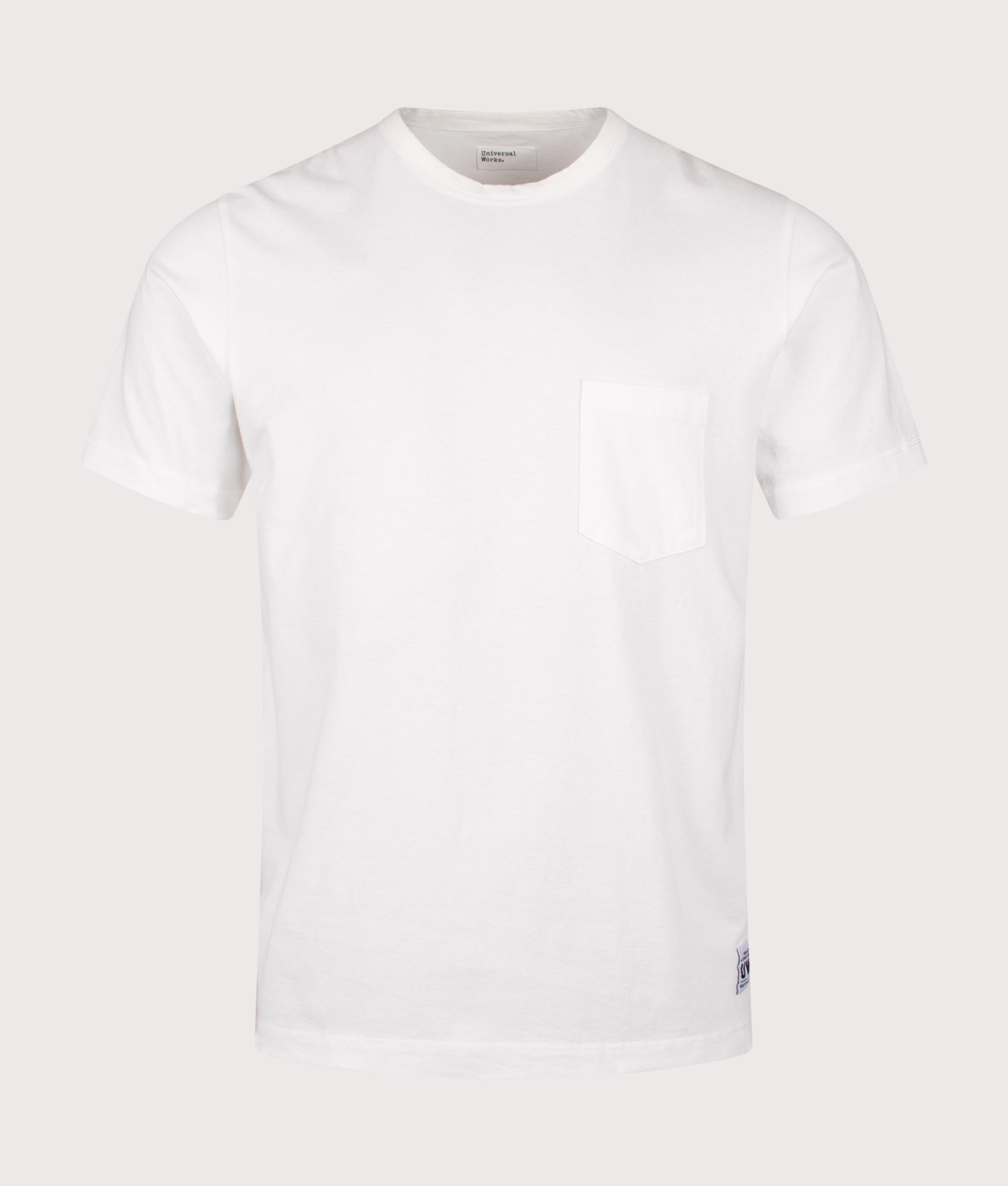 Universal Works Core Pocket T-Shirt in Antique White at EQVVS Menswear. Front shot.