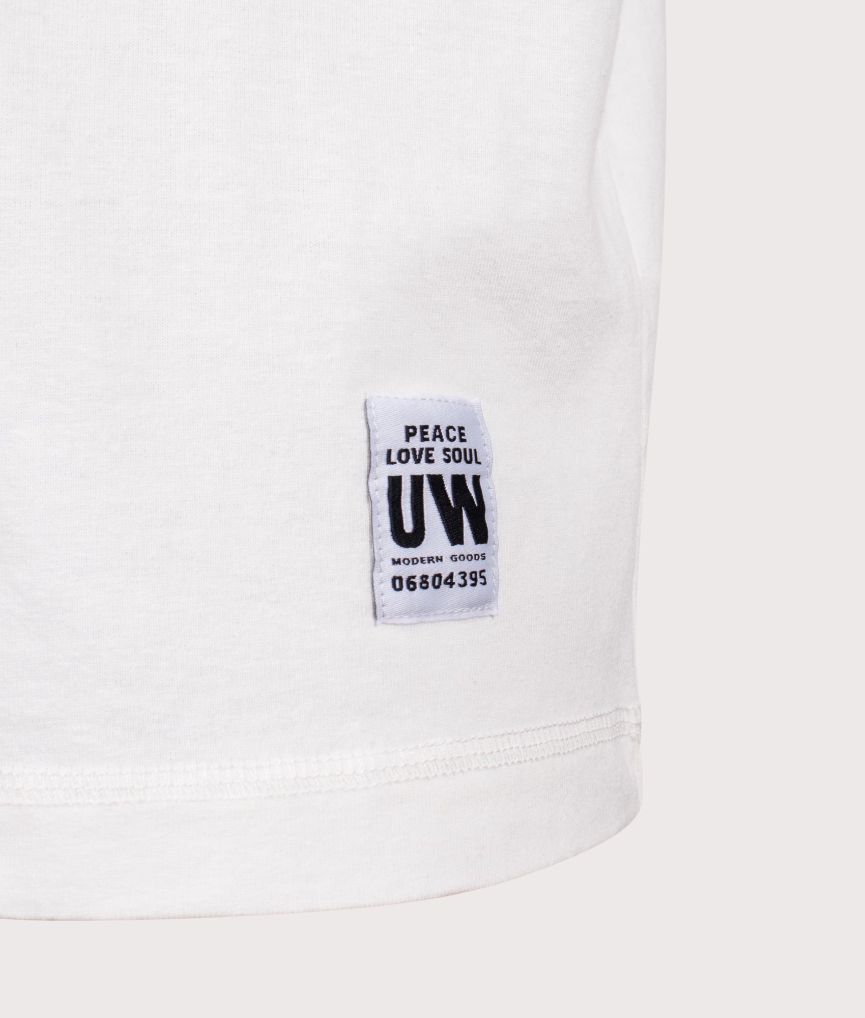 Universal Works Core Pocket T-Shirt in Antique White at EQVVS Menswear. Detail shot.