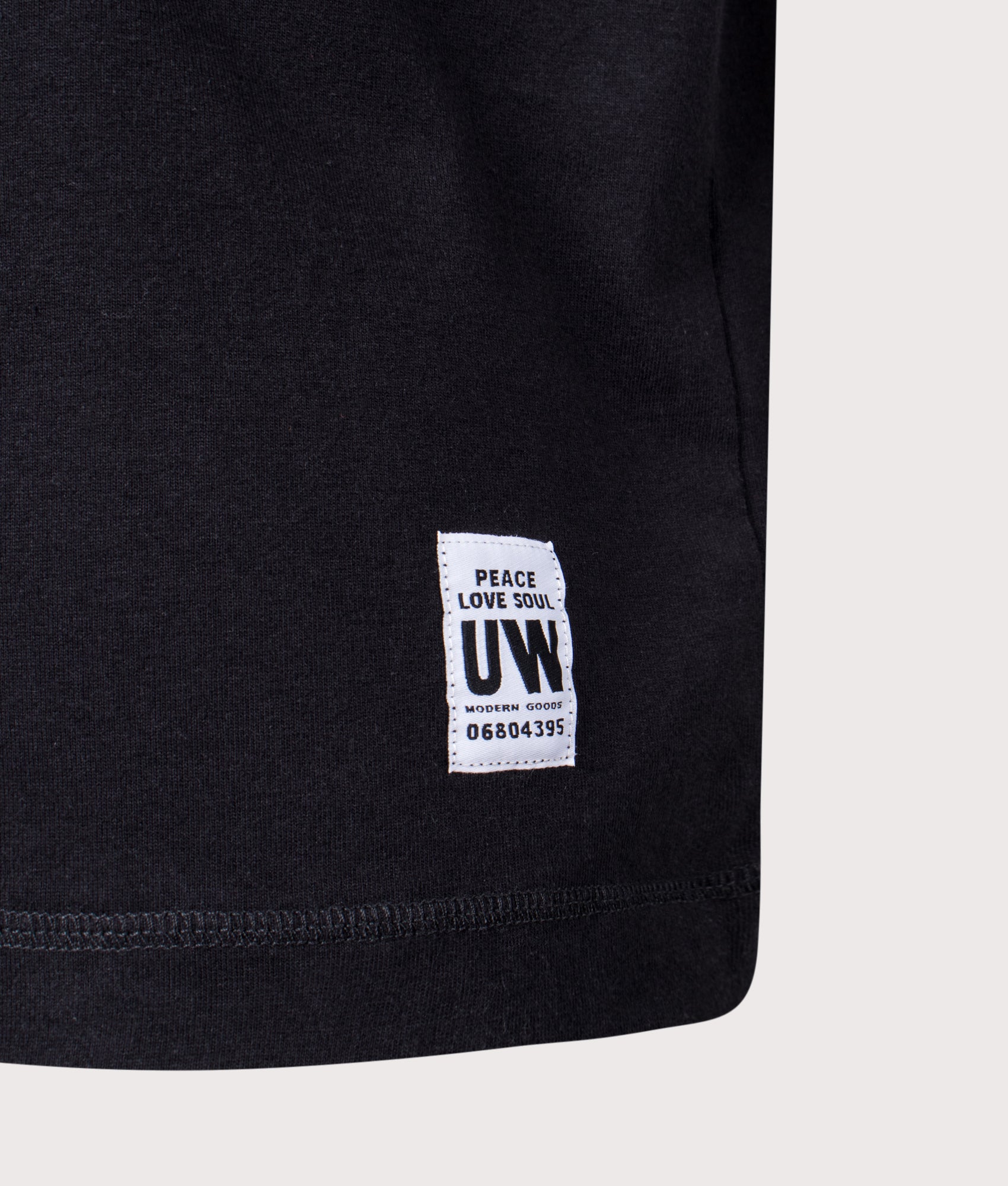 Universal Works Relaxed Fit Core Pocket T-Shirt in Black at EQVVS Menswear. Detail shot.
