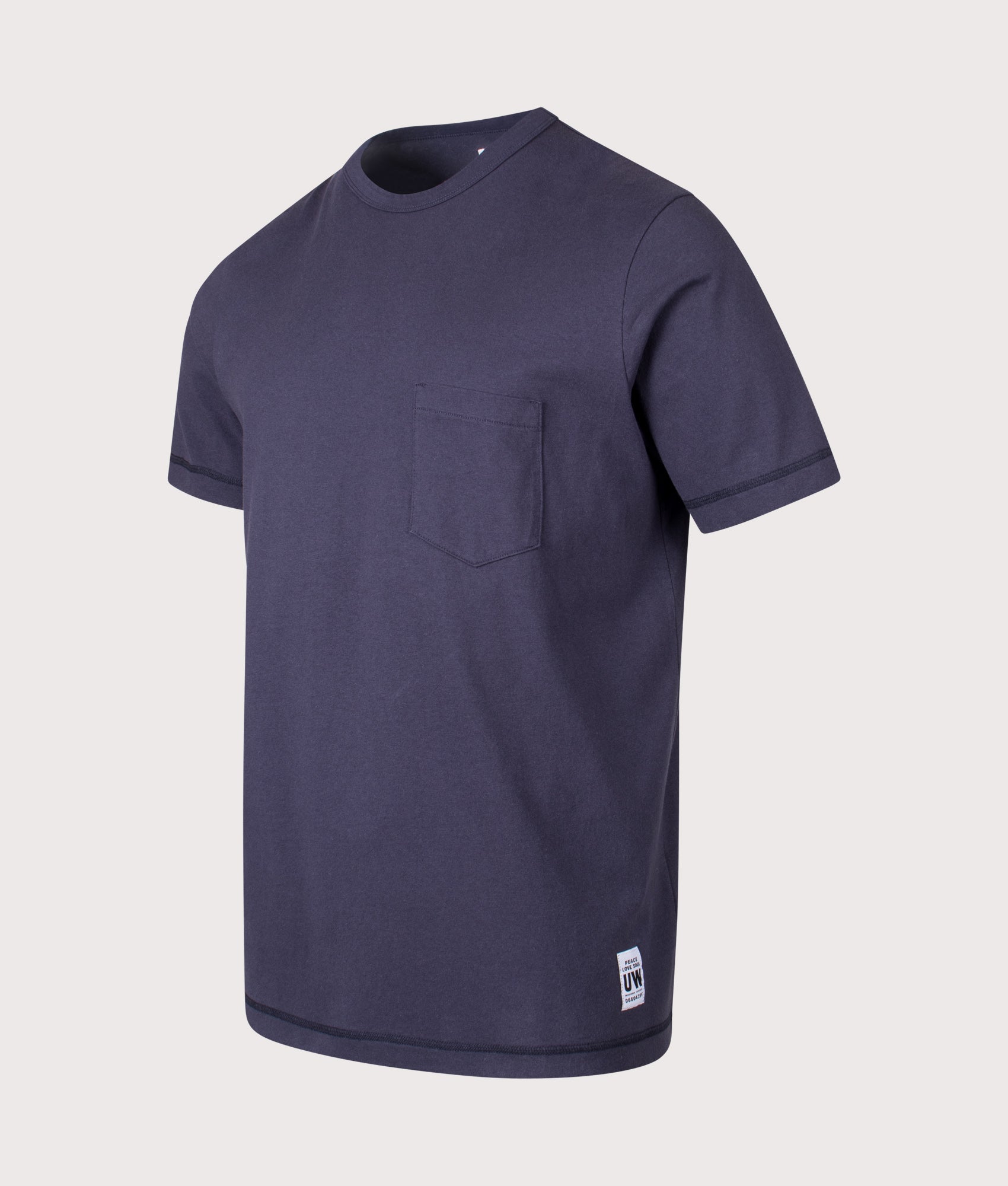 Universal Works Relaxed Fit Core Pocket T-Shirt in Navy at EQVVS Menswear. Front shot.
