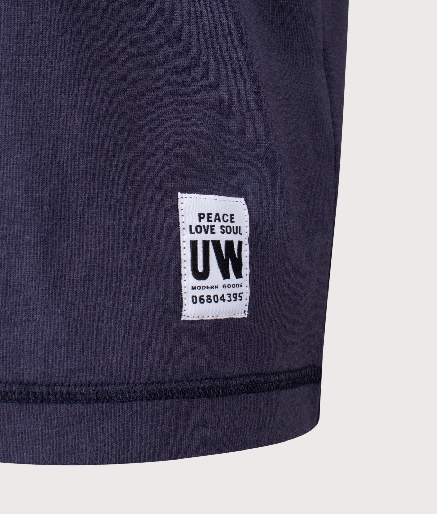 Universal Works Relaxed Fit Core Pocket T-Shirt in Navy at EQVVS Menswear. Detail shot.