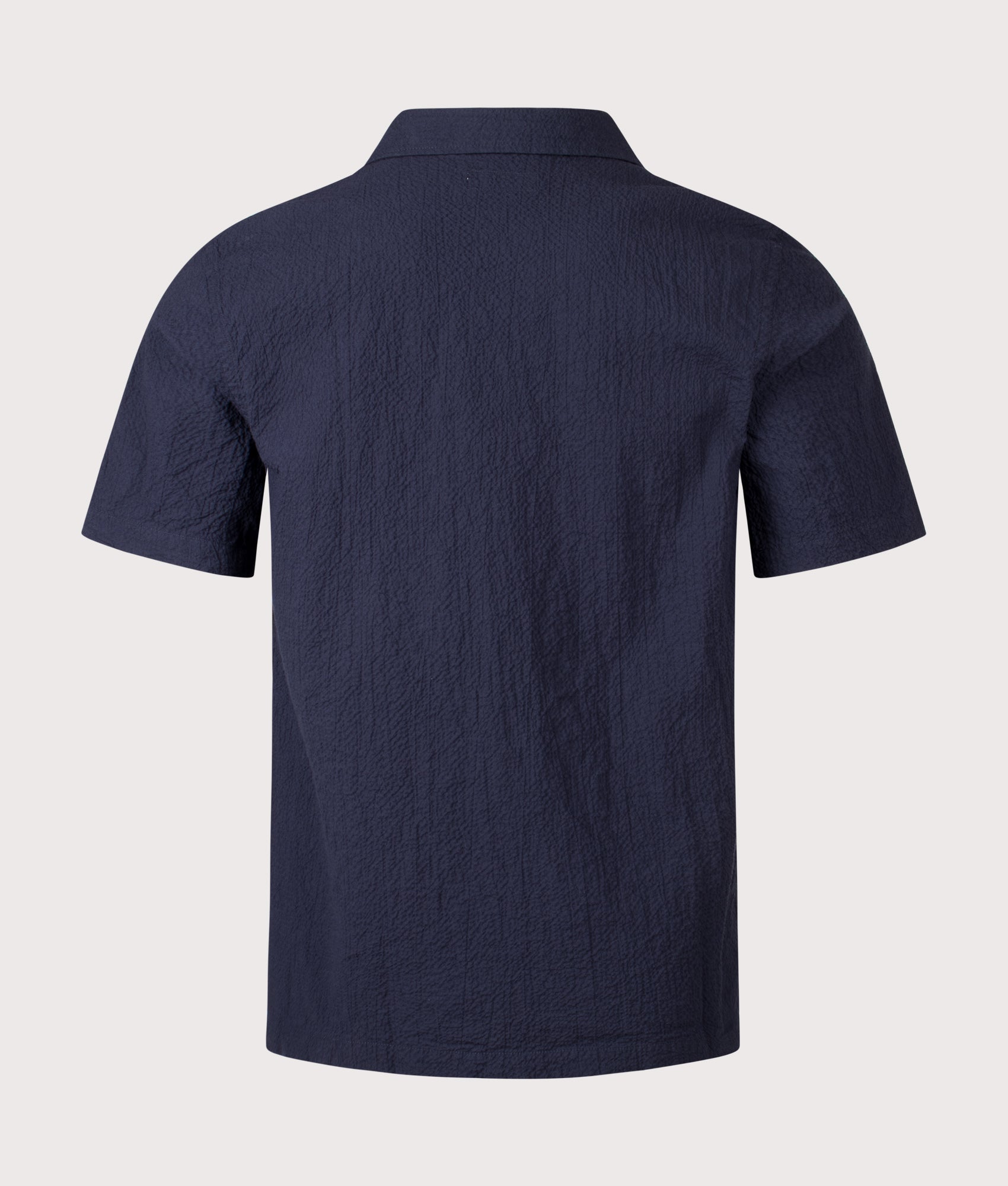 Universal Works Seersucker Road Shirt in Navy at EQVVS Menswear. Back shot.