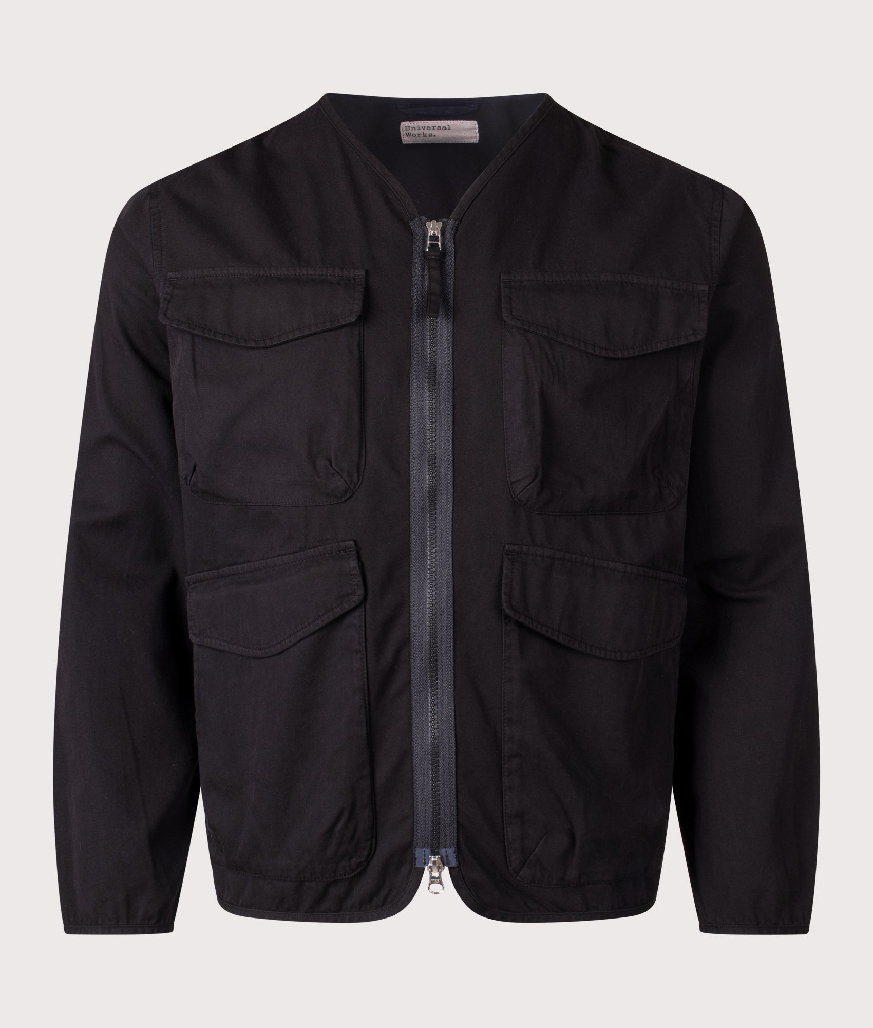 Universal Works Glider Short Jacket in Black at EQVVS Menswear. Front shot.