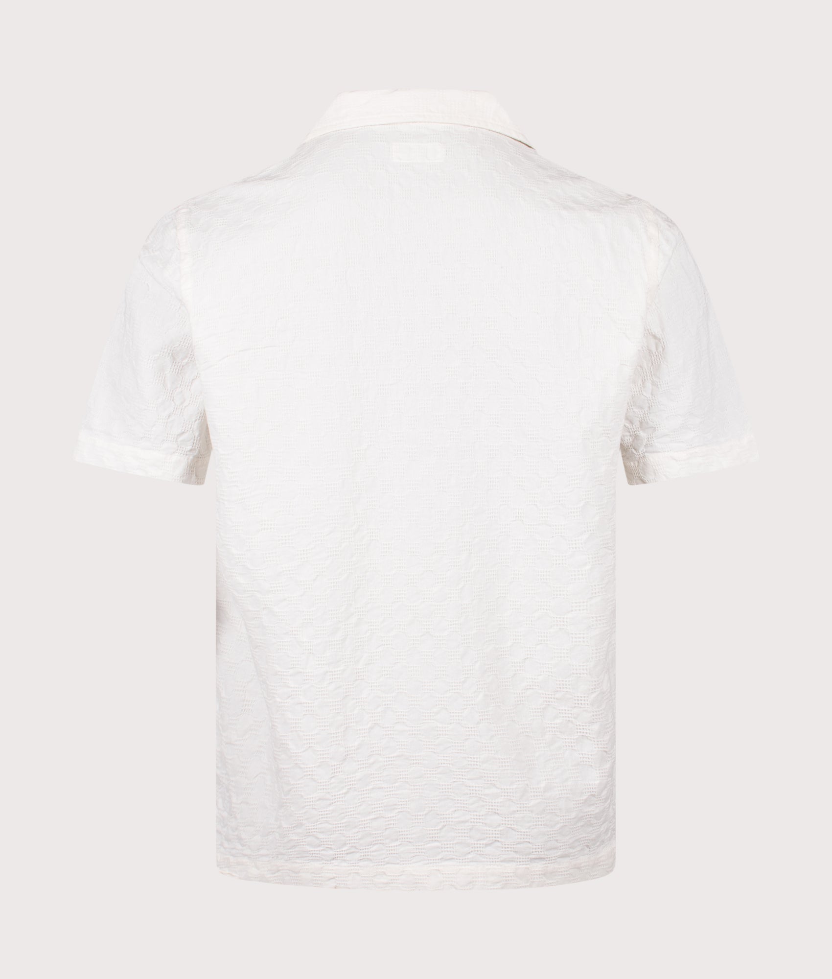 Universal Works Short Sleeve Seersucker Road Shirt in Ecru at EQVVS Menswear. Back shot.