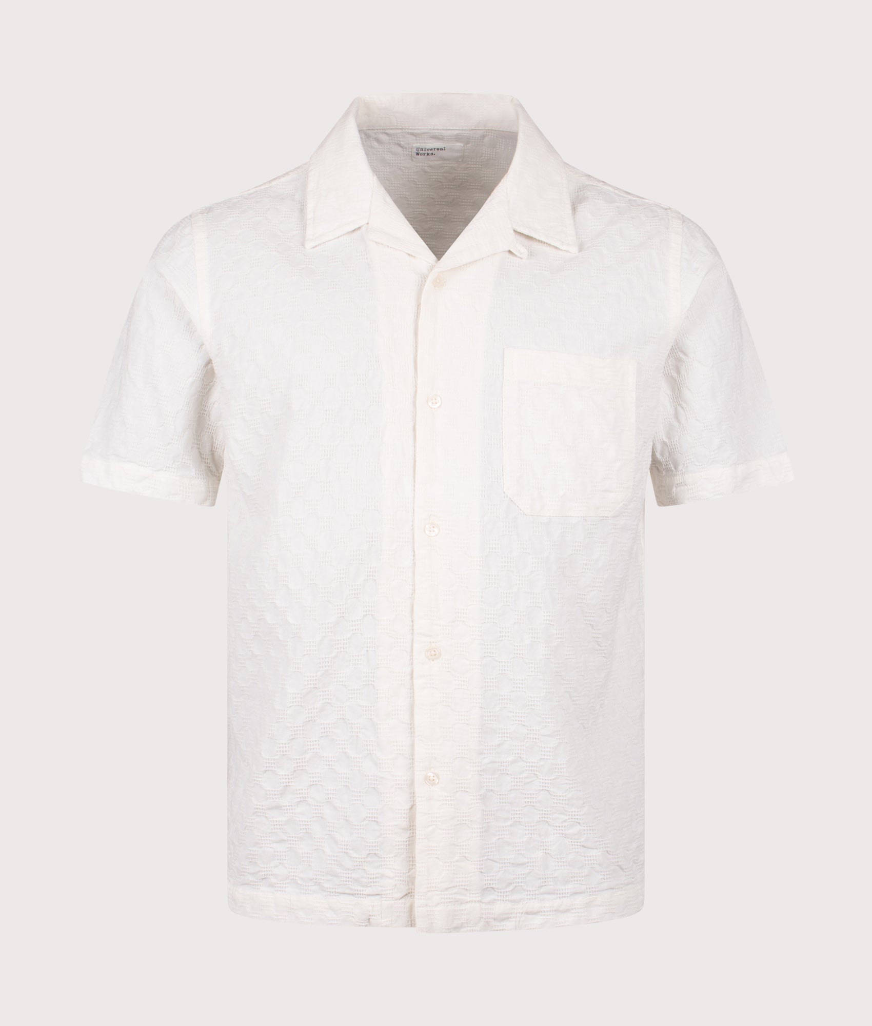 Universal Works Short Sleeve Seersucker Road Shirt in Ecru at EQVVS Menswear. Front shot.