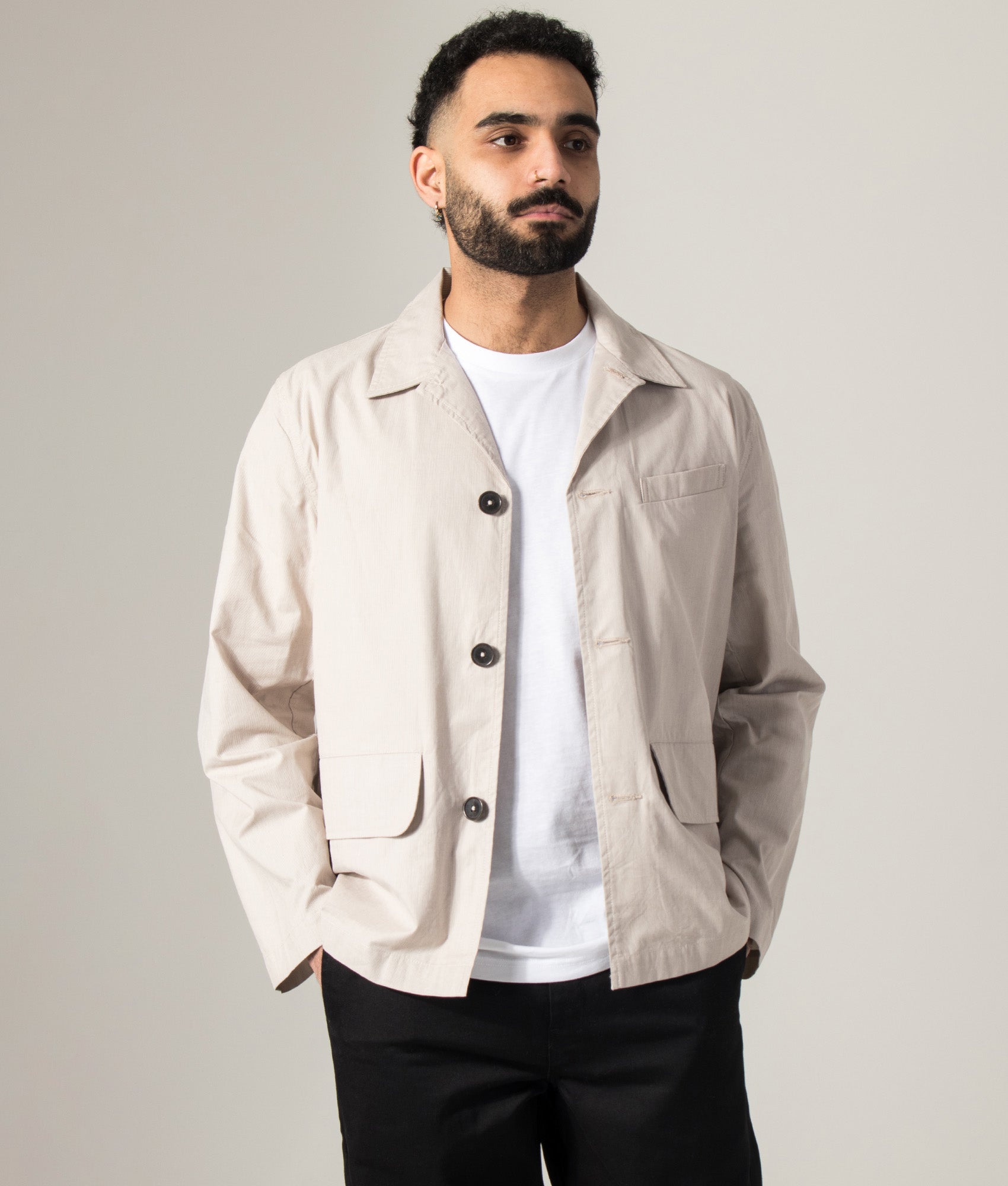 Universal Works Kennedy Stripe Franck Jacket in Brown at EQVVS Menswear. Model front shot. 