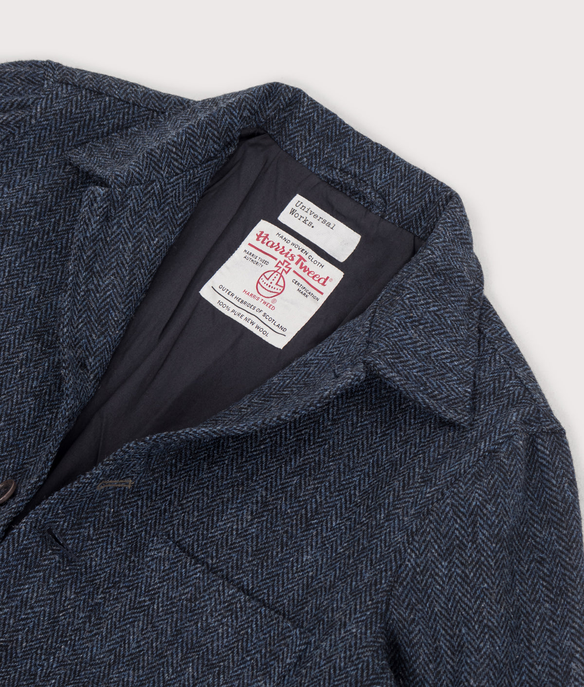 Universal Works Loose Fit Harris Tweed OG Bakers Jacket in Blue and Black at EQVVS Menswear. Detail shot.
