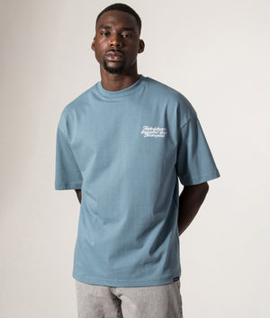 Faded Relaxed Fit NSC Face T-Shirt in Basalt at EQVVS Menswear. Model front shot.