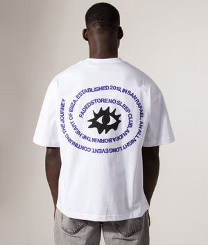 Faded Relaxed Fit NSC Circle Eye T-Shirt in White at EQVVS Menswear. Model Back shot.