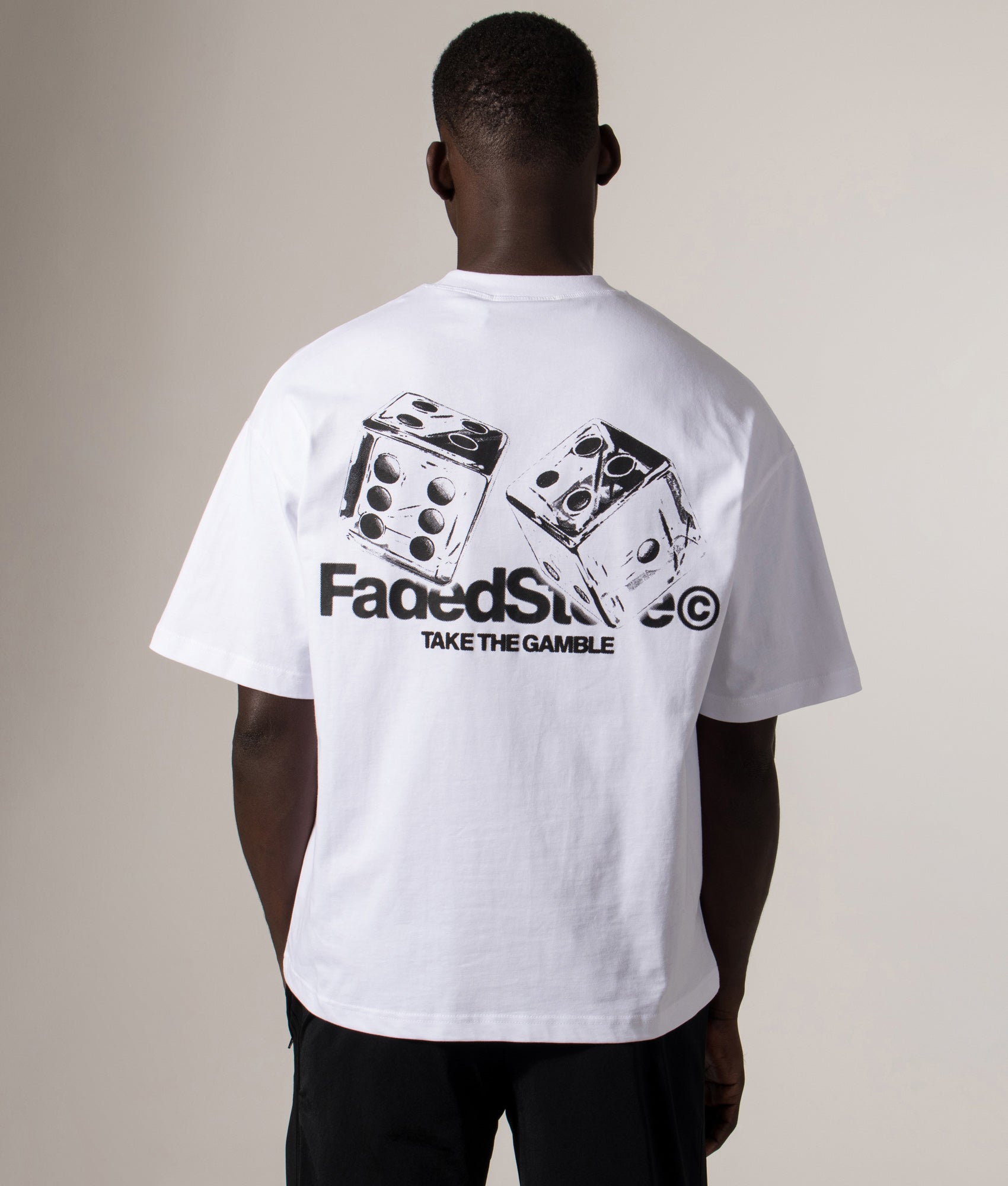 FADED Relaxed Fit Take The Gamble T-Shirt in White at EQVVS Menswear. Model back shot. 