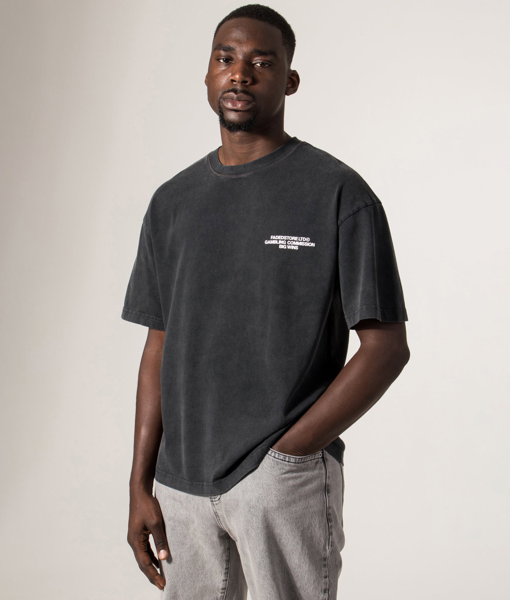 FADED Relaxed Fit Big Wins T-Shirt in Black at EQVVS Menswear. Model front shot.