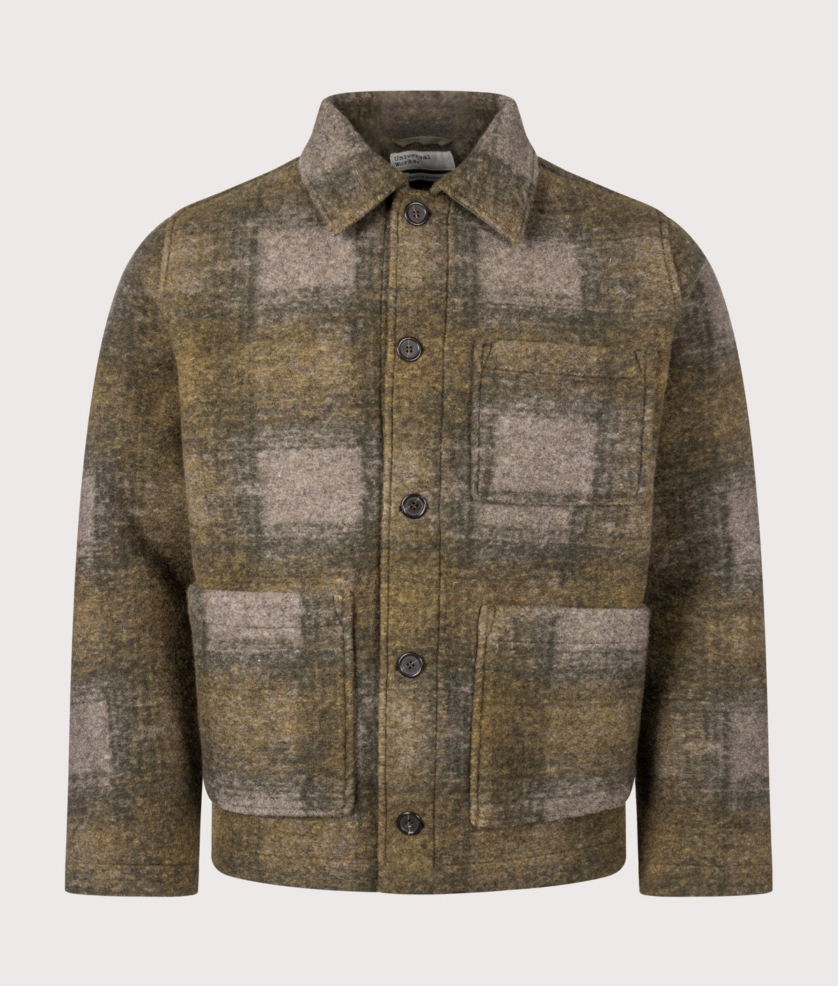 Universal Works Loose Fit Techno Melton Check Tag Jacket in Olive at EQVVS Menswear. Front shot.