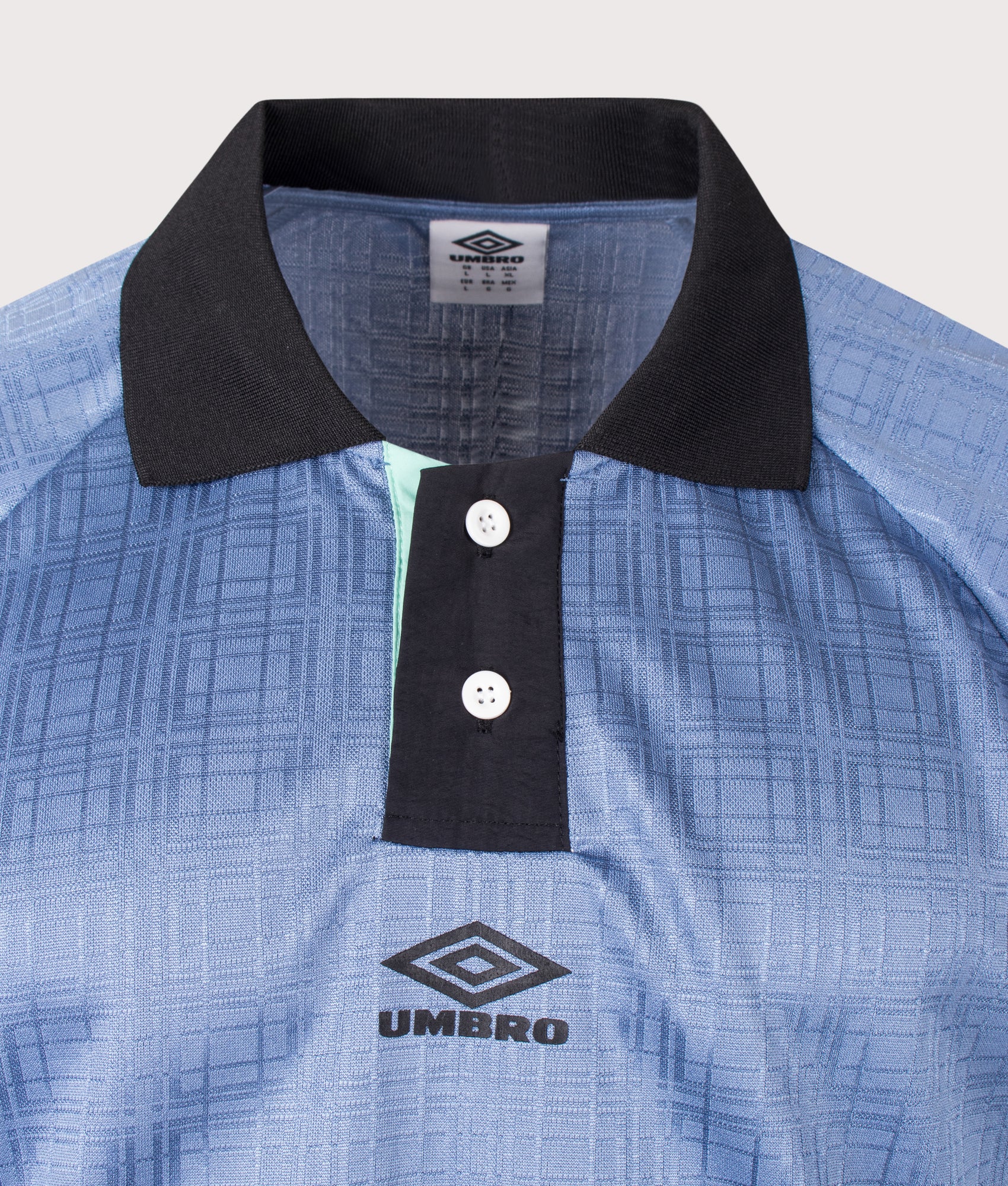 Umbro Football Shirt in Infinity, Black and Ocean Wave at EQVVS Menswear. Detail shot.