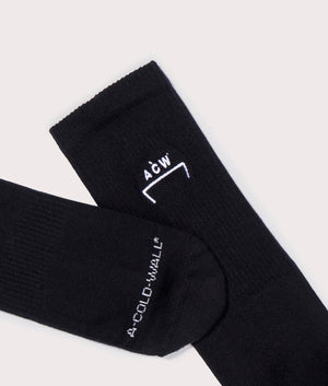 A-COLD-WALL* Bracket Socks in Onyx Black with White Ankle and Toe Branding Detail Shot at EQVVS