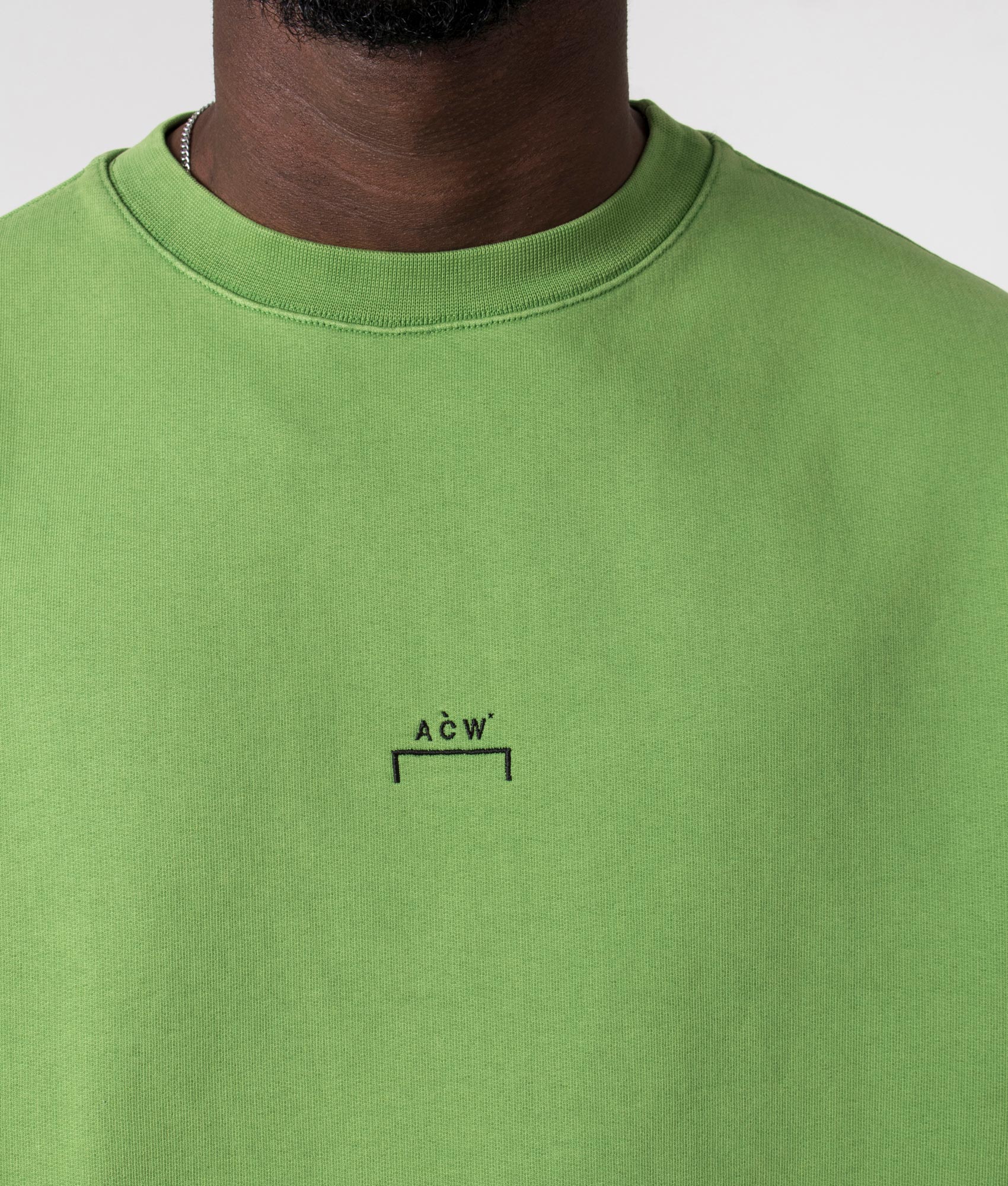A Cold Wall Essential Sweatshirt in Volt Green Detail  Model Shot at EQVVS
